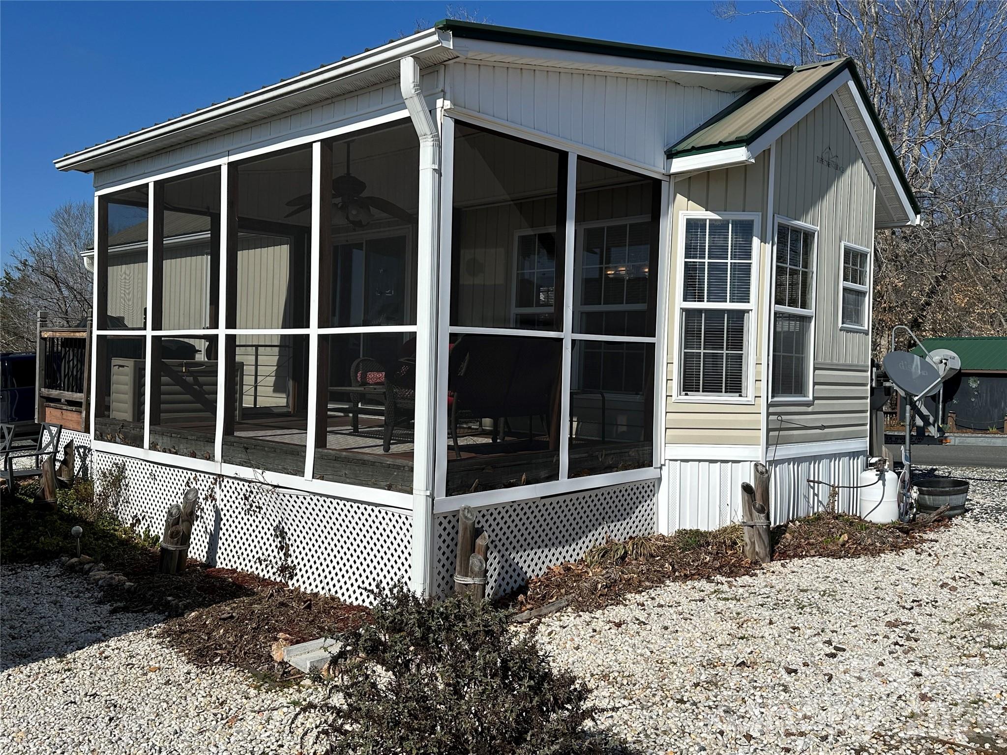 Enjoy stunning long-range views of Badin Lake from this furnished 1-bedroom park model, complete with a screen porch perfect for relaxing or entertaining. Whether you're preparing meals in the kitchen or dining inside, you'll always have a front-row seat to the lake's beauty. This property offers abundant parking—room for your boat and several vehicles—making it ideal for weekend getaways or full-time lake living. Located in the gated, waterfront community of Badin Shores Resort, you'll have access to a wide range of amenities including a waterfront boardwalk, clubhouse, putt-putt, basketball courts, playgrounds, fishing pier, sandy beach, and lake swim area. Perfect for those seeking a low-maintenance lifestyle with plenty of recreational opportunities, this home is your ticket to lake life at its best. Whether you're looking for a peaceful retreat or an active community, this property has it all. Don’t miss your chance to own a slice of paradise!