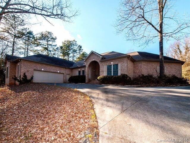 Beautiful, captivating custom built solid brick single story home on a private 1 acre wooded lot where an oasis awaits! Imagine warm summer evenings on your poolside veranda entertaining family and friends with cook outs, or relaxing in the pool! This spectacular home has private baths in three of its bedrooms, Special features include 4th bedroom/office, Tiled bathrooms, an oversized two car garage, abundance of storage, luxurious master suite with entrance to pool! Convenient to Charlotte!