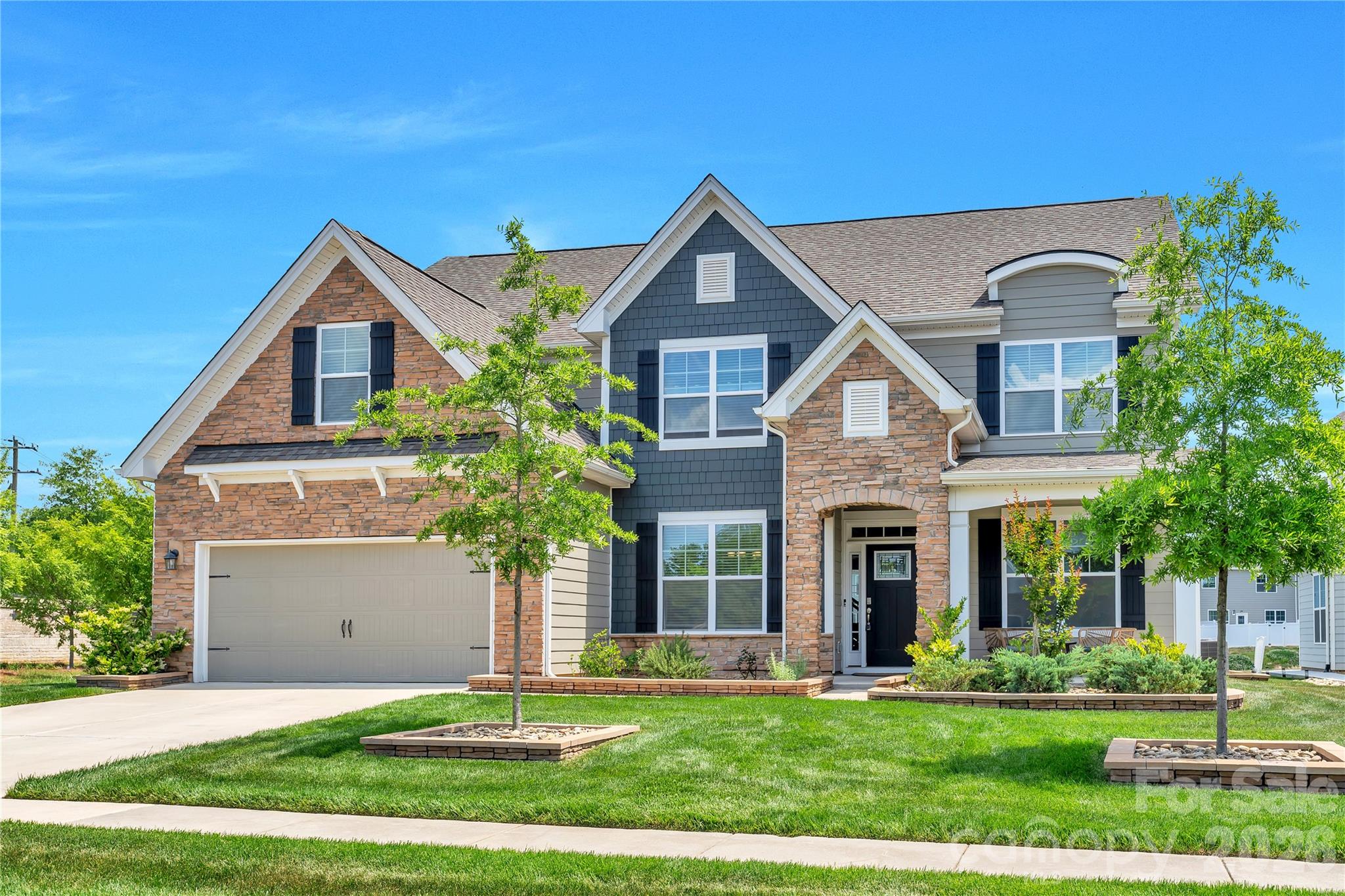Experience a true lifestyle upgrade in this stunning 5-bedroom home in the highly desirable Avondale community. It sits on a prime corner lot with great curb appeal and easy road access. To ensure the privacy you want and deserve, the seller is professionally adding privacy trees to the backyard, perfectly complementing the existing extended paver patio, built-in fire pit, and professional stone-accented landscaping.
Inside, the open Washington floorplan is bright and spacious, featuring a gourmet kitchen with granite countertops, a 5-burner gas cooktop, and a butler’s pantry. The first floor also includes a private guest suite, a dedicated office with French doors, formal dining room, sunroom, and a cozy fireplace on the main floor.
Upstairs includes a luxurious primary suite, three more bedrooms, and a huge media room that could even be a 6th bedroom. The finished garage has fresh paint and durable epoxy flooring. Residents enjoy resort-style amenities, including a clubhouse, gym, pool, and pickleball courts, all within minutes of Ballantyne’s premier shopping and dining.