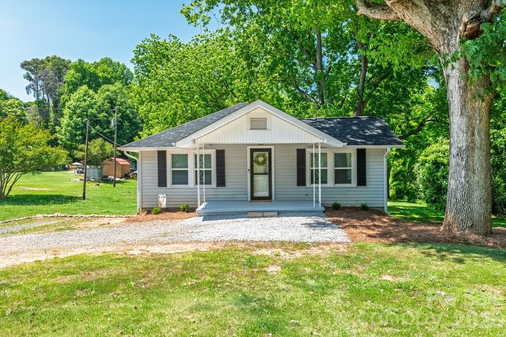 Welcome to this beautifully updated 3 bedroom, 2.5 bath home with basement, perfectly situated on a private lot of nearly an acre in Gastonia. Offering a functional layout with flexible living spaces, this home combines comfort, updates, and convenience.

Inside, you’ll find an updated interior featuring spacious kitchen with stainless steel appliances, ample cabinet space, and room to gather and entertain. The large primary bedroom offers a relaxing retreat complete with an updated ensuite bathroom and stand in shower. Downstairs, the additional living area could easily serve as a 4th bedroom, recreation room, or media space, while the separate flex space makes a perfect home office, playroom, or gym.

Major updates include a 2025 roof, newer HVAC system, and septic system installed in 2023, providing peace of mind for years to come. The large basement offers excellent storage space and additional functionality.

Outside, enjoy the privacy and space of the expansive yard, ideal for entertaining, gardening, pets, or simply enjoying the peaceful setting.

Conveniently located with easy access to both Gastonia and the Charlotte metro area, residents enjoy an easy commute to Uptown Charlotte while being just minutes from Belmont, Lake Wylie, shopping, dining, and outdoor recreation. Outdoor enthusiasts will appreciate the close proximity to Crowders Mountain State Park, nearby lake access, parks, and green spaces offering opportunities for hiking, boating, and enjoying the outdoors.

This home offers the perfect blend of privacy, updates, and location.