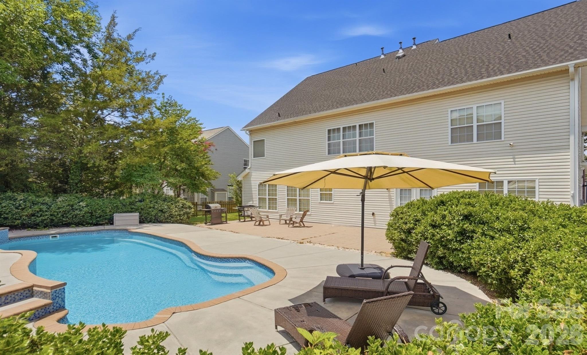 Ready for Summer? This stunning and rare home offers over 4,000 square feet and is located in the highly sought-after Brandon Oaks community—perfectly designed for both everyday living and unforgettable entertaining.

Begin your tour with the upgraded brick front, oversized side-load 2-car garage, and .31-acre lot ideally positioned between two cul-de-sacs. Inside, you’ll find a spacious and thoughtfully designed layout filled with natural light and flexibility.

The chef’s kitchen features granite countertops, stainless steel appliances, a large island with breakfast bar, kitchen desk/office area, huge pantry, and an open breakfast area with beautiful backyard views. The open floor plan flows seamlessly into the large living room with fireplace and accent wall, creating the perfect gathering space. An elegant dining room (or home office) with chair rail molding adds charm and versatility.

The main level includes a bedroom with full bathroom, two additional flex rooms, and a half bath, offering endless possibilities for home offices, playrooms, or guest space.

Upstairs, the primary suite impresses with double doors, a beautiful ensuite bath, and a huge walk-in closet with bonus attic storage room. Bedrooms 3 and 4 share a Jack-and-Jill bathroom, while a 5th bedroom and additional full bath provide ample space for everyone. The second floor also features a large bonus room.

The third floor offers an enormous bonus room—perfect for a media room, gym, game room, or additional living space or create into a studio apartment

Step outside to the private, fenced backyard oasis, complete with a beautiful in-ground pool with waterfall feature, expansive patio space for relaxing or entertaining, and a large grassy area beyond the pool—truly the perfect summer retreat.

Brandon Oaks offers resort-style amenities including two pools (a large lap pool and a resort-style pool with slide), covered picnic areas, clubhouse, playground, walking trails, lakes, and basketball, volleyball, tennis, and pickleball courts, along with year-round social events. Ideally located near Sun Valley, with convenient access to shopping, dining, and entertainment.

This home truly has it all—space, location, lifestyle, and summer-ready fun!