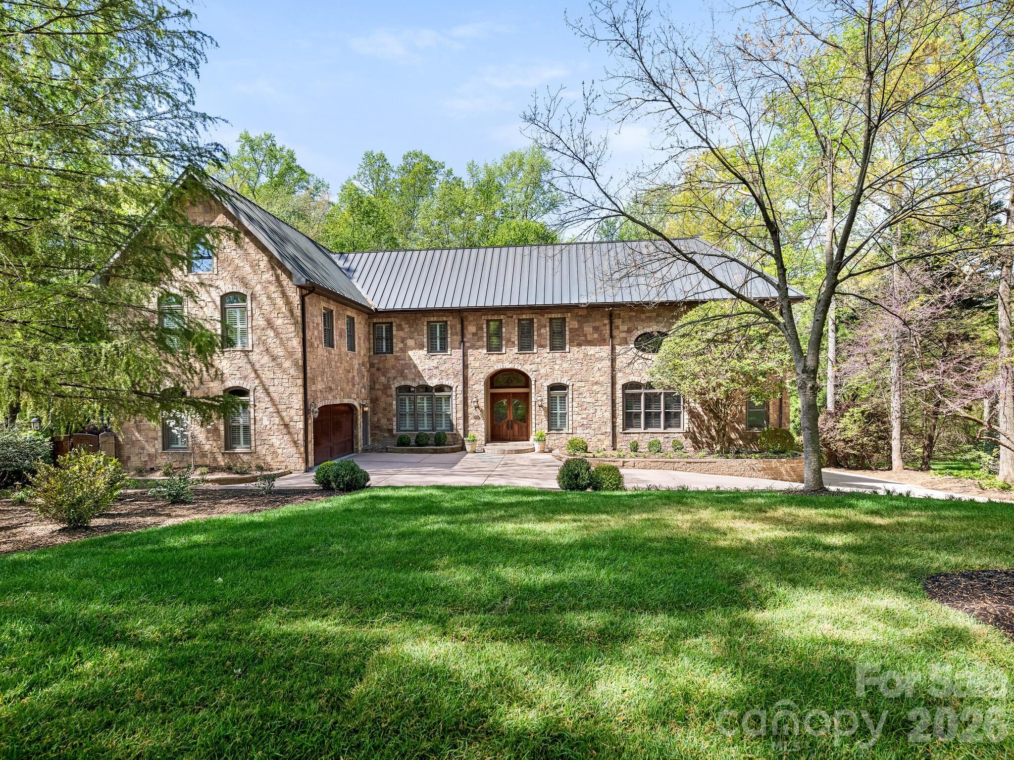 This one of a kind well built home is a hidden jewel situated on 1.47 acres. You are nestled away with beautiful  landscaping, mature trees, gardens , beautiful pool, plenty of outdoor entertaining area, covered porch and balconies. Freshly painted throughout the inside of the home, new hardwood flooring, new countertops in upstairs bathrooms and laundry room, new recessed lighting in bedrooms, new bathrooms on lower level. This spacious home has everything you desire, formal dining room, bar and scullery, handsome Library and Study, Great Room Den or Music room, two powder rooms , laundry room and doors to the covered and screened porch all on the main level. The Primary bedroom has access to the covered porch, nice size bathroom and extremely large closet that has access to the study. Upstairs has three bedrooms with their own bathrooms, exercise room, small office/Library  reading area overlooking the Study, large Game/Recreation room, half bath , Bonus room and an additional room. The bonus room and additional room could be a second primary and you could add a full bath to the additional room. Lower Level, has a potential movie theater room, kitchen, full bath, playroom , bedroom and full bath, Outdoor pool area is a hidden oasis that has the potential of a private yard beside the pool! This home willl not last long on the market!!