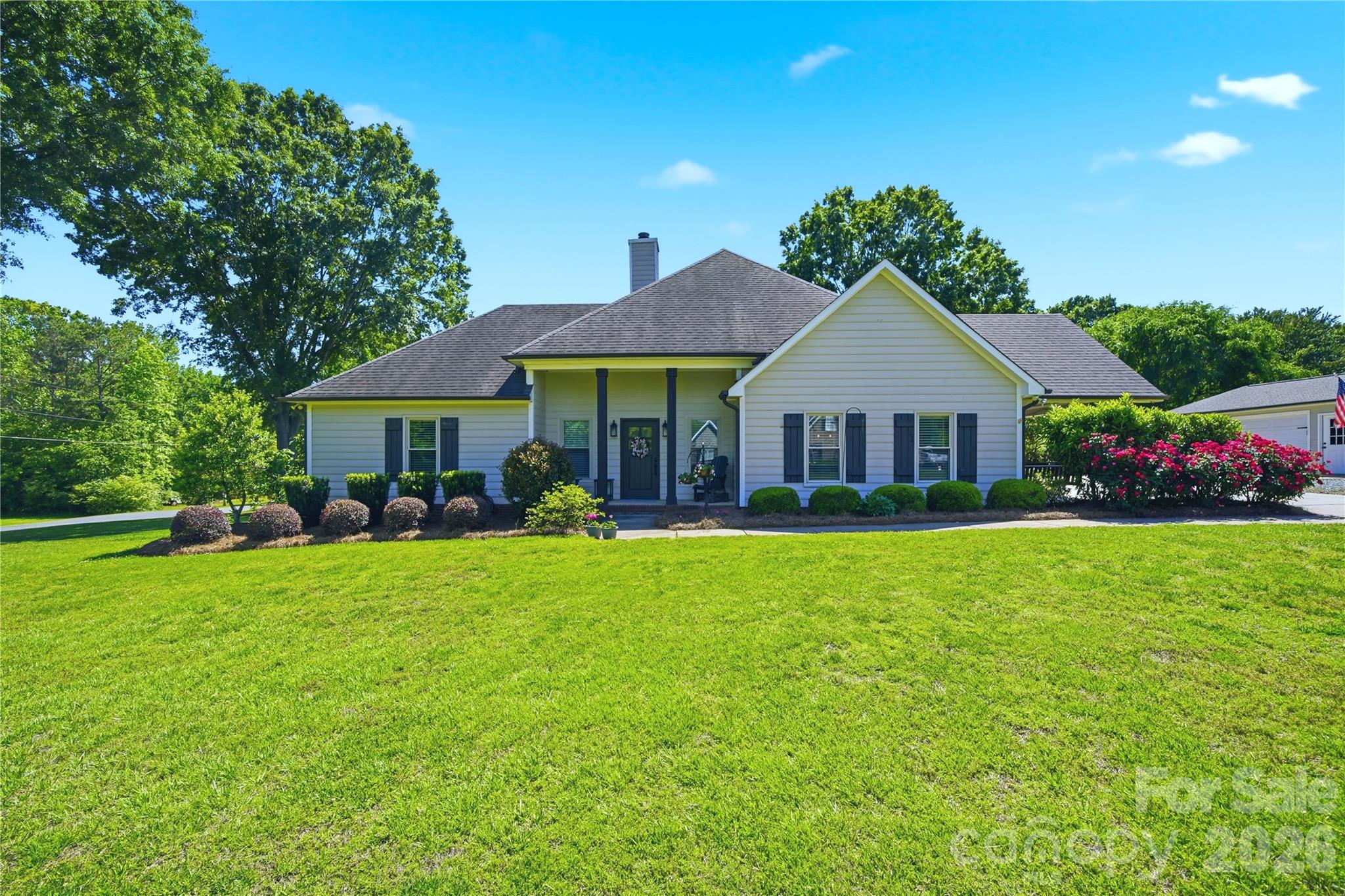 Rare opportunity to own a home in the Weddington school district with nearly an acre of land and no HOA at an unbeatable price! Prime location just 3 minutes from Wesley Chapel Elementary and 6 minutes from the Monroe Executive Airport or shopping at Village Commons (Target, Chick-fil-A & more).  You will feel right at home in this modern farmhouse featuring an open floorplan and upgraded conveniences like a large kitchen island with quartz countertops, beautiful cabinetry, farmhouse sink, SS appliances and a tankless hot water heater. Gather in the main living area around a cozy gas-log fireplace, or step outside to enjoy the fresh air on one of three distinct deck/patio spaces. The primary suite offers a generously sized ensuite bathroom and a large walk-in closet with custom shelving. Two additional secondary rooms (one currently utilized as a bonus/exercise area) share a full hall bath. Note: Septic permit is for two bedrooms. Flexibility abounds with a dedicated office that can easily serve as a formal dining room. Outside, the 0.95-acre flat lot is a gardener’s dream, featuring majestic oaks, fruit-bearing fig trees, and a fenced-in raised bed garden. The detached 2-car garage provides extra parking and covered storage, complemented by a concrete parking pad and additional shed. Don't miss this Union County gem!