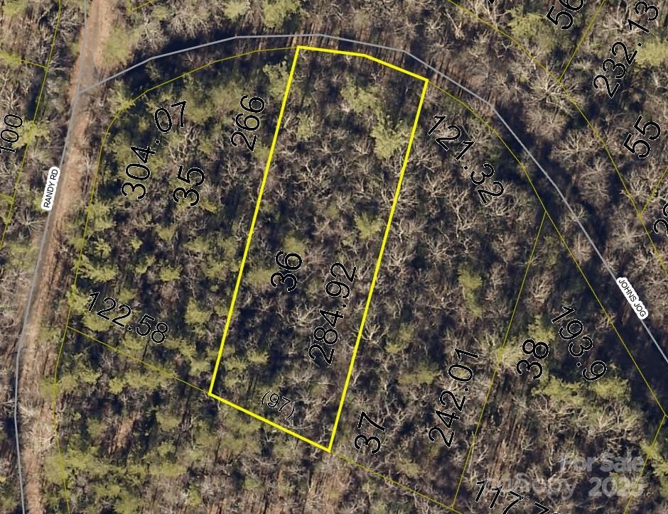 .61-acre lot on Johns Log in Connelly Springs, NC, within the Pine Mountain Lakes POA. Gently sloped and surrounded by trees, with nearby walking trails, playgrounds, picnic areas, and duck ponds. A perfect spot to build and enjoy peaceful, nature-filled living.