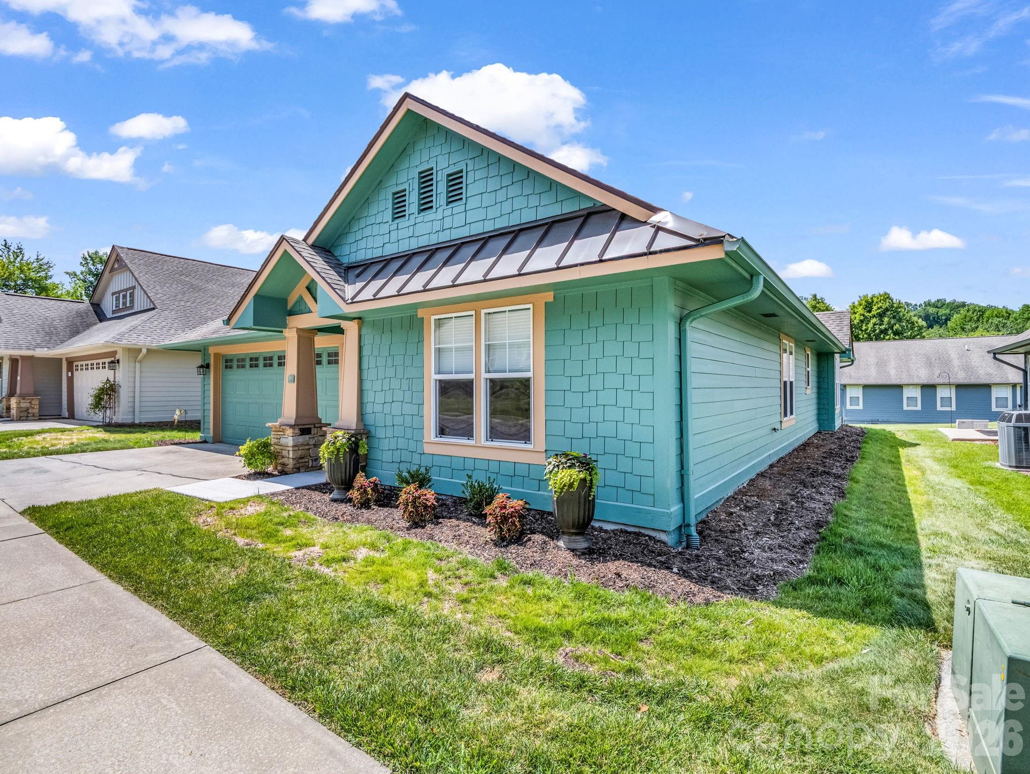 Discover the perfect blend of timeless charm and modern convenience in this stunning 3-bedroom, 2-bathroom Craftsman style cottage. Nestled within the premier gated community of Wolfpen, this bright and airy home features a seamless open floor plan flooded with abundant natural light, real hardwood floors throughout the foyer and kitchen areas and cozy carpet in the bedrooms. The smart split-bedroom layout ensures maximum privacy, while recent high-value updates provide total peace of mind, including elegant granite countertops, a brand-new HVAC system installed in 2025, whole interior home painting in 2025, new roof in 2021, updated primary shower, skylights and a RING doorbell security system. Living here feels like a permanent vacation, giving you exclusive access to resort-style amenities such as a clubhouse, fitness room, heated pool, putting green, tennis/pickleball courts, and scenic walking trails. A diverse social calendar of events is offered with excellent community participation (see attached).  Best of all, you are in an unbeatable location: less than one mile from the interstate, under 10 minutes to downtown Hendersonville’s fantastic shopping, dining, and medical facilities, 15 minutes to the Asheville Regional Airport, and a quick 30-minute drive to downtown Asheville.  Don't miss the opportunity to make this your forever home or home away from home today!!