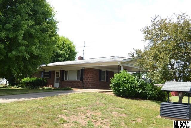 USDA Eligible according to the maps! Close to town and move in ready! Brick ranch w/full basement, 2.07 acres which includes lot beside the home, two stall barn, separate storage bldg,  Beautiful hardwood floors & tile, no carpet! Updated kitchen w/oak cabinets custom built by Precision Cabinetry featuring pull outs in lower cabinets and pantry, tile floor, fresh paint throughout, laundry moved upstairs to the smallest bedroom but could be moved back to basement, full basement has tons of storage space or use as your workshop, single garage in basement, very private setting back from the road and an extra large lot to spread out and play! Rock on the front porch or relax on the side deck. Total tax value of $135,800 includes extra lot!