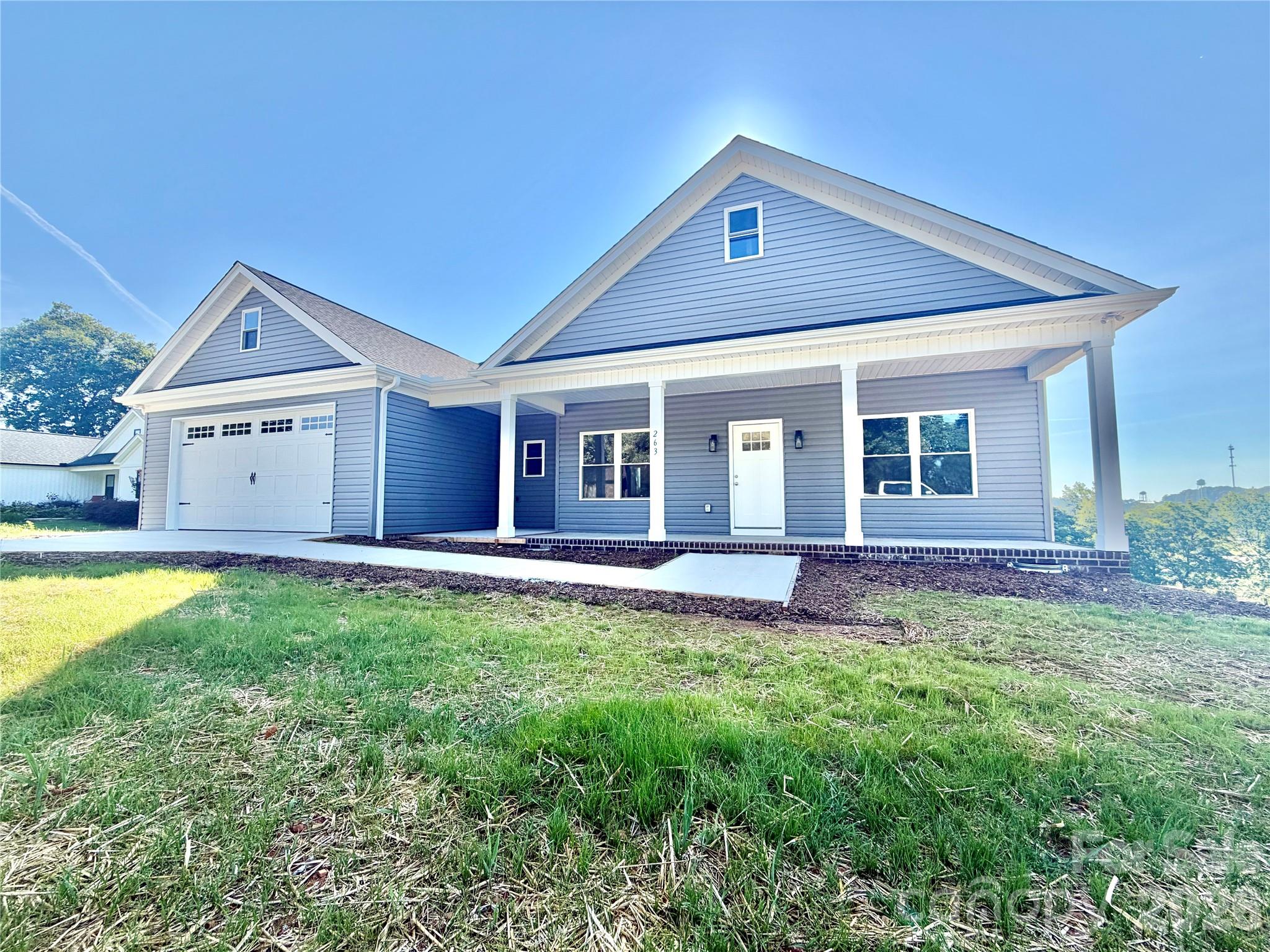 Stunning new construction with modern finishes & open concept living. Welcome home to this beautifully crafted new construction featuring 3 bedrooms, 2 full baths, and a spacious double garage. From the moment you arrive, you will appreciate the inviting covered front porch, perfect for relaxing and enjoying the outdoors. Step inside to an open floor plan designed for today's lifestyle, featuring recessed lighting throughout and an abundance of natural light. The heart of the home is the gorgeous island kitchen, complete with elegant, quartz countertops, ample cabinetry, and plenty of space for entertaining family and friends. The spacious primary suite offers a luxurious retreat with a tiled walk-in shower, double vanity, and thoughtfully designed built-in closet organizers for maximum storage and convenience. The additional bedrooms provide comfort and versatility for family, guests, or a home office. 
This exceptional new home combines style, comfort, and functionality in one beautiful package. Don't miss your opportunity to own this move-in-ready gem!!!