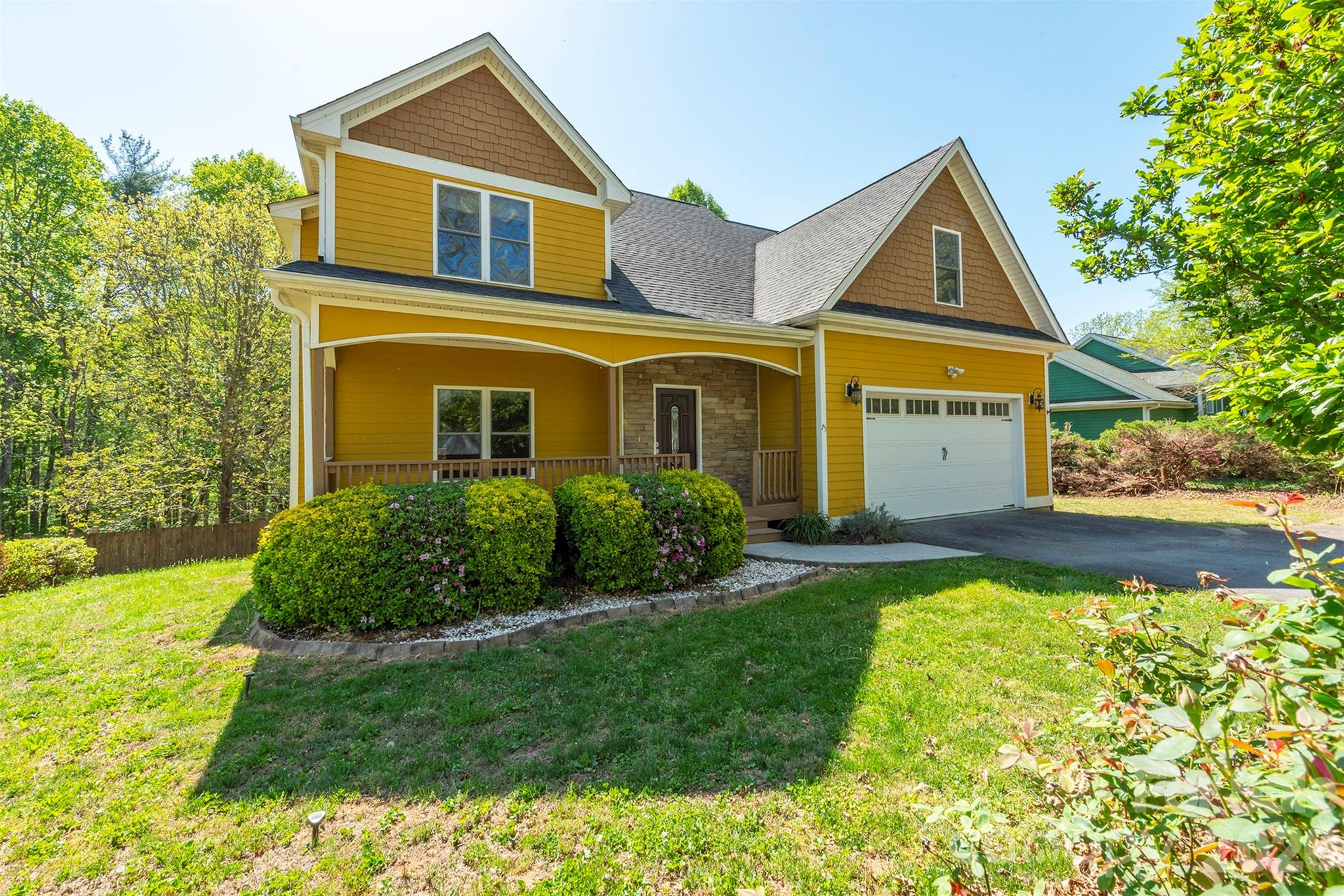 Welcome to 75 Noble Rd in Fairview! This is warm and inviting home offering flexible living spaces, thoughtful upgrades, and a serene natural setting just minutes from Asheville.

On the main level, you’ll find beautiful yellow pine flooring and a cozy gas fireplace in the living room, creating a welcoming atmosphere throughout. The kitchen serves as the heart of the home, offering ample cabinetry, generous counter space, and a functional layout ideal for both everyday living and entertaining. With easy flow into the main living areas, it’s perfectly positioned for gatherings with family and friends. Storage is abundant across the home, making organization effortless.

This well-maintained property features 3 bedrooms with a convenient Jack & Jill bathroom, plus an ideal in-law living arrangement for extended family or guests. The spacious upstairs family room boasts a second gas fireplace, while the recreation room provides additional space for entertaining, hobbies, or relaxation.

Step outside to enjoy a private, beautifully landscaped backyard highlighted by mature magnolia trees, crape myrtle trees, and blueberry bushes. In the winter months, take in peaceful mountain views from your own property. Additional features include a water filtration system and leaf guard gutters for added convenience and peace of mind.

Located in the desirable Fairview area, this home offers easy access not only to Asheville, but also nearby communities such as Black Mountain, Weaverville, and Hendersonville—giving you the perfect balance of privacy and accessibility to shopping, dining, and outdoor recreation.

A rare combination of comfort, versatility, and natural beauty—this property can also be a rental!