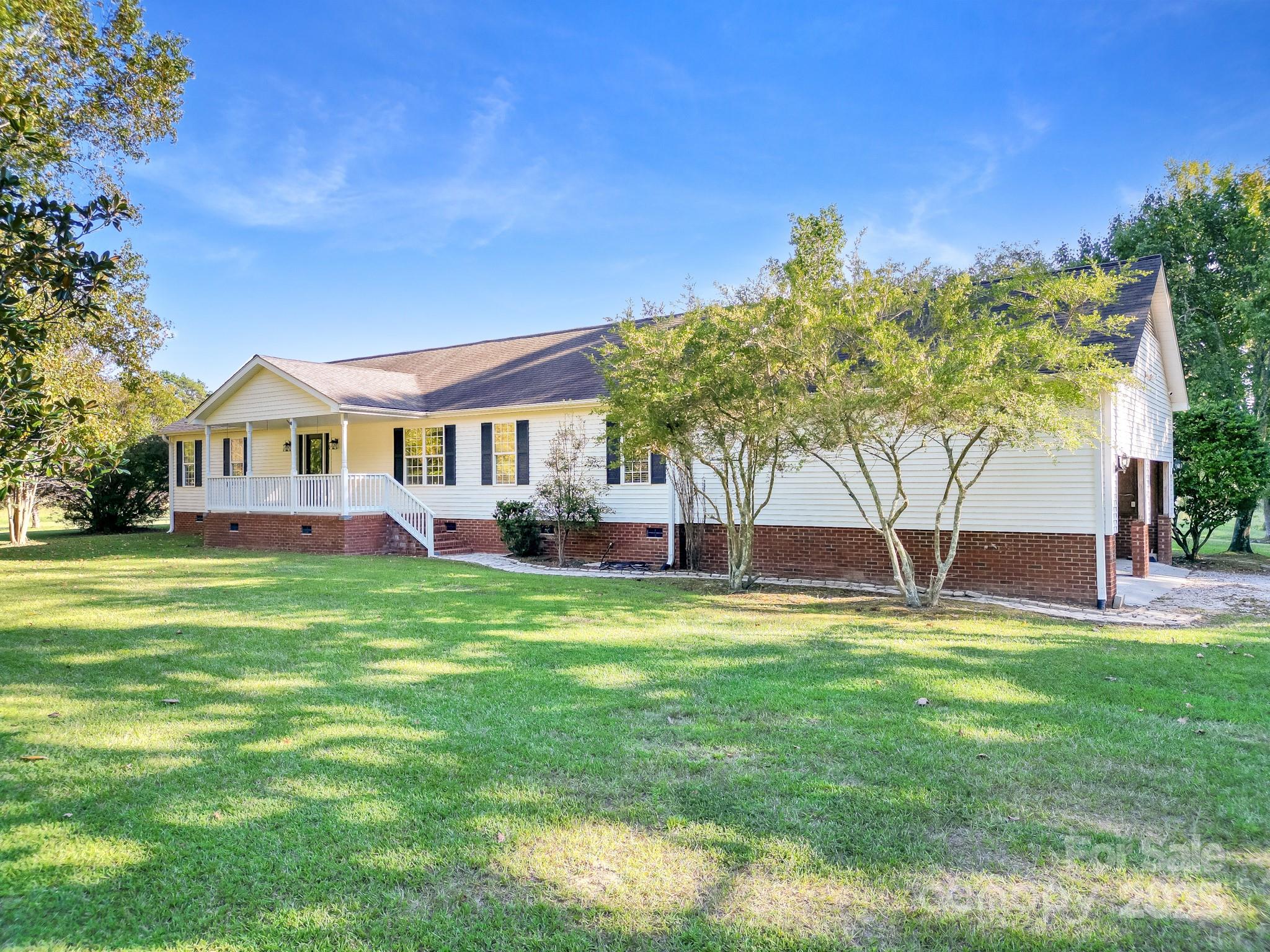 If you have been searching for acreage in Buford, your opportunity has arrived! This 19.34 acre property features a serene half-acre stocked pond and plenty of cleared land, ready for your enjoyment. The property offers two adjoining parcels, each containing 9.67 acres. Together, the rectangular shaped tracts sit side by side, creating an expansive 19.34 acre property with endless possibilities. At the heart of it all sits a charming 3 bedroom, 2 bath modular home with a spacious 2 car attached garage. The homes' highlight is the stunning 4 seasons sunroom. boasting floor to ceiling windows that bring the outdoors in. You'll also love the brand new deck, perfect for hosting family and friends. A 20 x 20 storage building provides additional space for all of your needs. This property offers both comfort and functionality in a serene setting. Come tour and see all it has to offer.