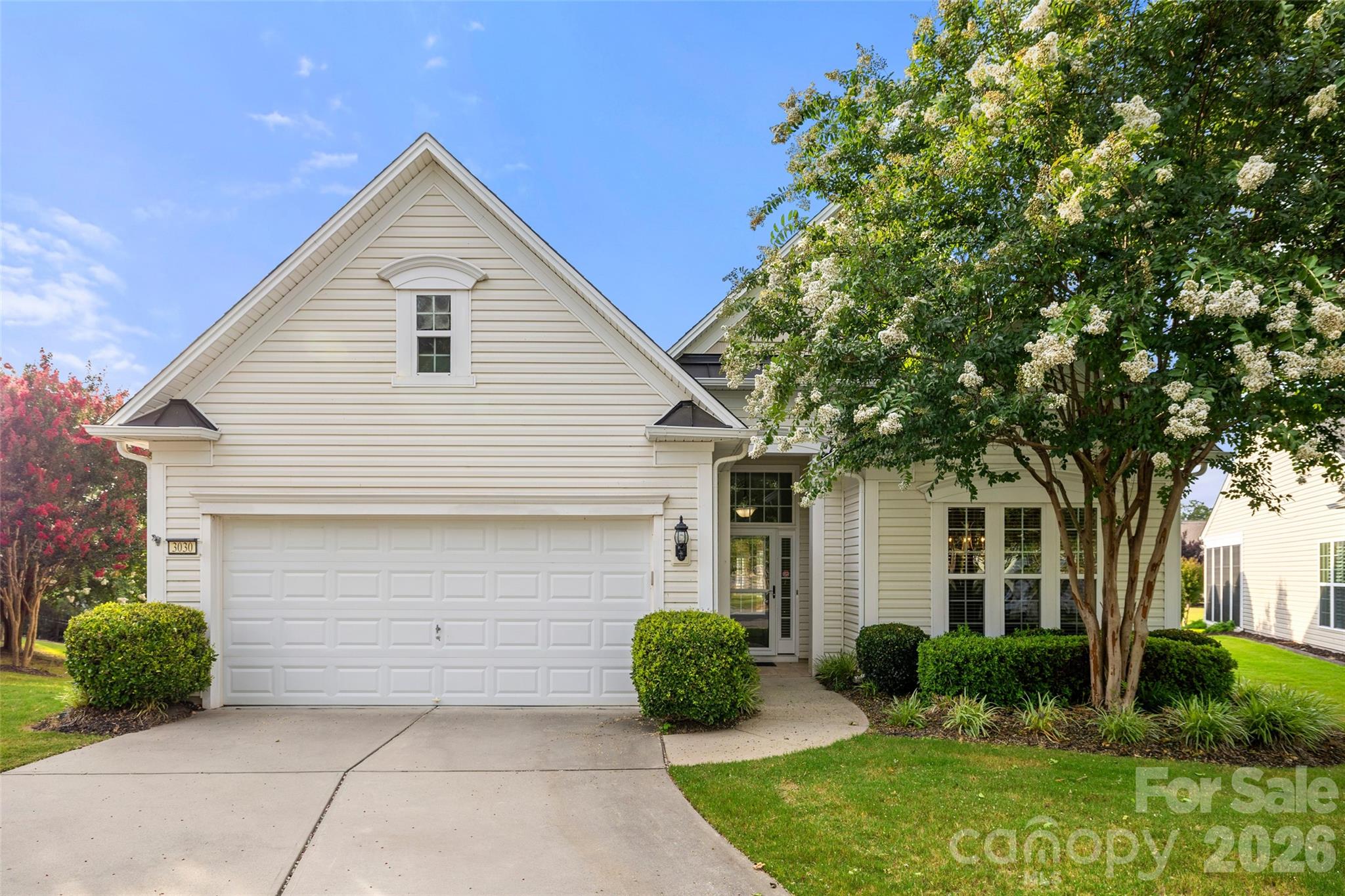 Beautifully updated and truly move-in ready, this Willow Bend home is tucked on a quiet cul-de-sac in the sought-after 55+ community of Sun City Carolina Lakes. Featuring new luxury vinyl plank flooring in the kitchen, dining area, great room, and sunroom, brand new carpet in the bedrooms, a stylish new kitchen backsplash, and fresh interior paint, this meticulously maintained home is ready for its next owner. Inside, you'll find crown molding, wainscoting, abundant natural light, and an open floor plan designed for comfortable everyday living and entertaining. The spacious kitchen features granite countertops, a center island with seating, abundant cabinetry, a pantry, and a sunny breakfast area with a built-in desk. The expansive great room flows seamlessly into a bright, light-filled sunroom surrounded by walls of windows, creating the perfect space to relax or gather with guests. The spacious primary suite features a tray ceiling, dual vanities, a garden tub, separate shower, and walk-in closet. A secondary bedroom, full bath, private office with French doors, and laundry room complete the thoughtfully designed layout. Enjoy the outdoors from the spacious deck overlooking beautifully landscaped grounds with peaceful views. Experience the award-winning amenities of Sun City Carolina Lakes, including golf, pools, fitness center, tennis, pickleball, walking trails, clubs, and endless social activities.