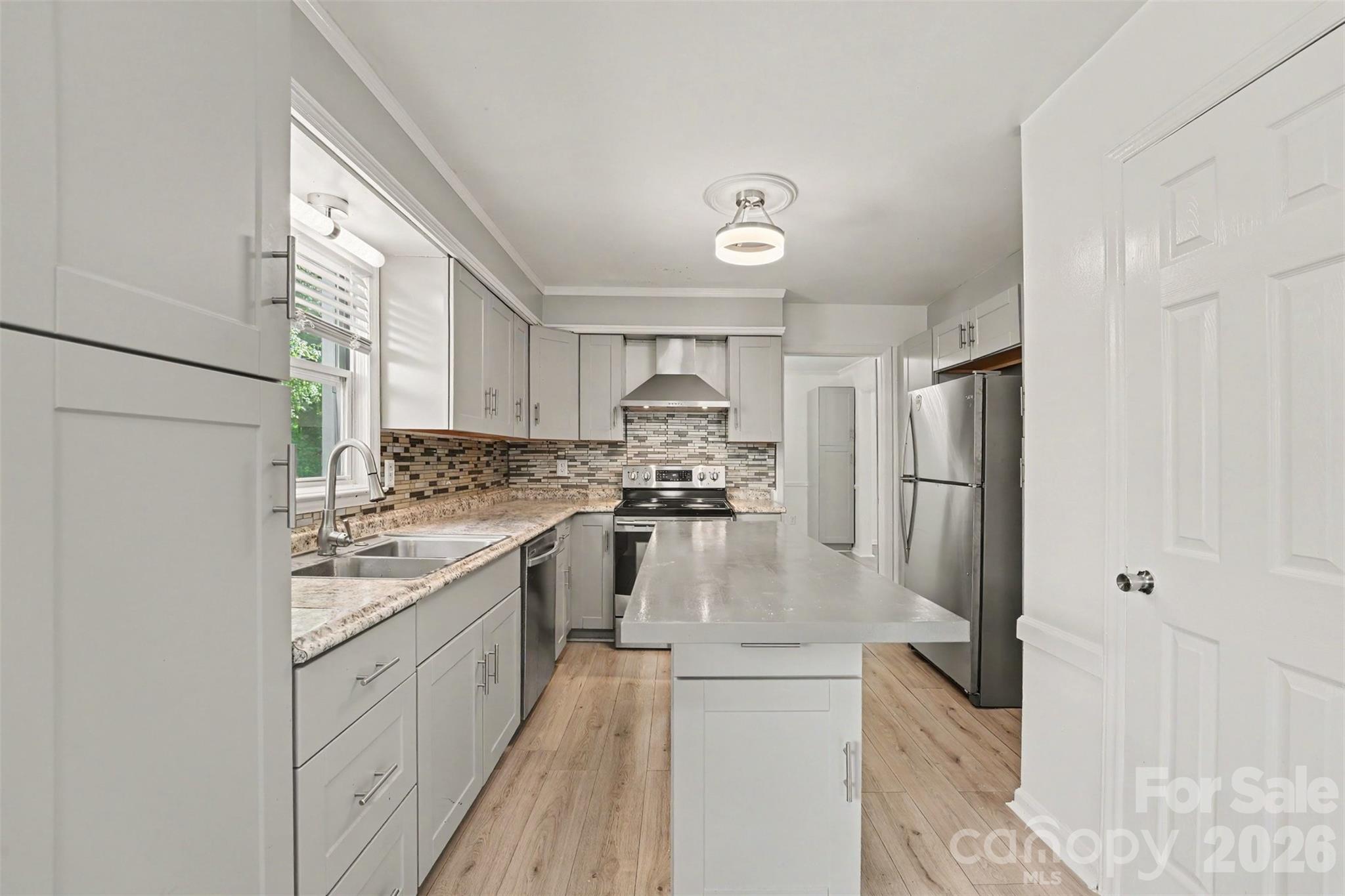 Welcome home to this beautifully updated 4-bedroom, 2.5-bath residence situated on a spacious half-acre corner lot, with the added privacy of a side street that dead ends. Thoughtfully maintained and move-in ready, this home offers the perfect blend of modern updates and functional living.

The updated kitchen and renovated bathrooms provide a fresh, contemporary feel, while major improvements offer peace of mind, including a new HVAC system (2024), newer roof (2020), insulated vinyl windows (2020), and low-maintenance vinyl siding (2020).

The generous outdoor living spaces are ideal for entertaining, featuring a large rear patio and an enclosed side porch for year-round enjoyment. A rear-entry two-car garage, expansive driveway with abundant parking, and a backyard storage shed add exceptional convenience.

All appliances convey, including both refrigerators and a new washer and dryer, making this truly an opportunity you won’t want to miss!