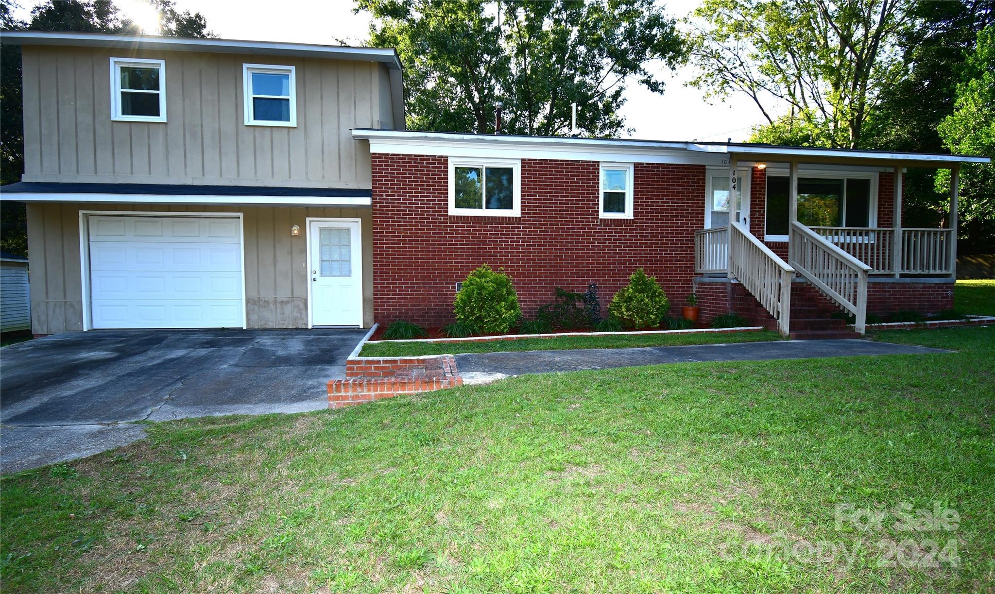 If you're looking for a home w/ a MOTHER-IN-LAW suite or a teenager suite OR A GUEST SUITE....look no further! This sweet brick duplex checks all the boxes.  On main level, it features 2 bedrooms, 1 bath, living room, kitchen w/ island, pantry/broom closet.  Stove, refrig., W/D, convey w/ home. Leave kitchen area going into a hall that leads upstairs to the guest house area, mother-in-law suite, or a teen area equipped w/ full bath, walk in closet,  kitchen, just a full 'tiny home' within a home.  Go downstairs to a comfy family den, pool table area, TV room, OR WHATEVER YOU WANT IT TO BE.....INCLUDING A GARAGE:  This area has HEAT & AIR TOO & nice flooring!  BUT, an electric garage door will open & this area COULD BE A GARAGE, if you like! There is also a wired work shop/storage behind home. This home is 1 block from Kershaw Elementary school, a block from the post office, grocery store, or convenience store. NICE AREA/ GOOD NEIGHBORS!!  COME TO KERSHAW!  You'll never want to leave!