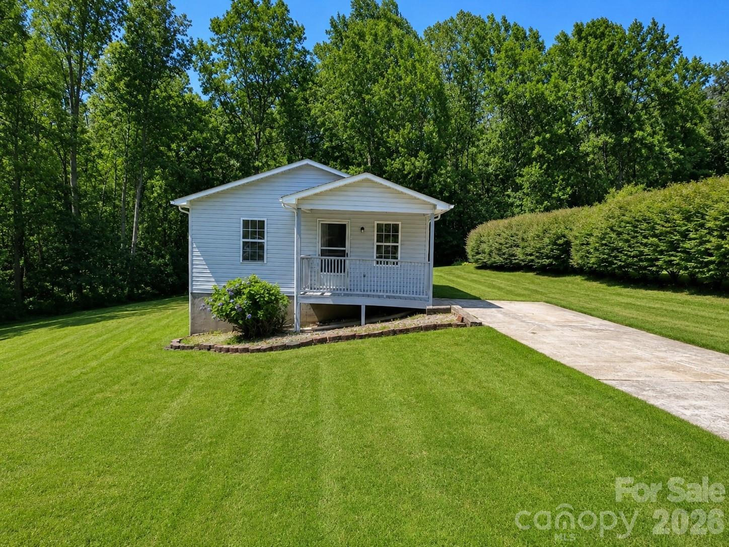 Situated on a spacious 0.75-acre lot, this charming bungalow is ready to welcome its new owner! Step inside to a generously sized living room with plenty of space for relaxing, entertaining, and hosting football Sundays with family and friends. Low maintenance luxury vinyl plank flooring flows throughout the home, creating a clean and cohesive look.

Just off the living area, you’ll find two comfortably sized bedrooms and a full bathroom. The open-concept kitchen and dining area offers ample room for preparing meals, gathering around the table, and enjoying family dinners.

Outside, the property features not one, but two porches perfect for sipping your morning coffee, unwinding in the evening, or enjoying the peaceful surroundings. With three-quarters of an acre, there is plenty of room to enjoy outdoor activities, gardening, entertaining, or simply appreciating the added privacy.

If you’ve been searching for an adorable home with space, privacy, and inviting indoor and outdoor living areas, look no further. Don’t let this wonderful opportunity pass you by—schedule your showing today!