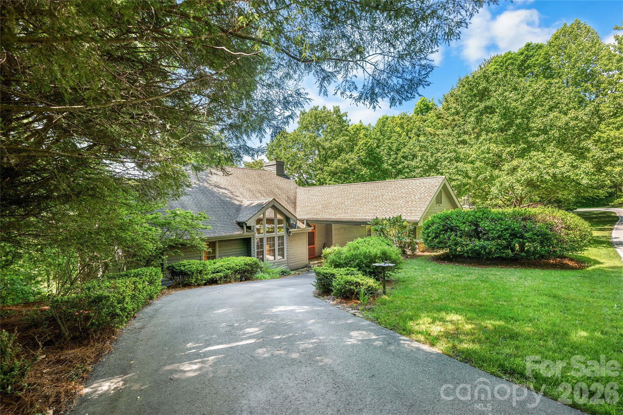 Positioned on 1.17 gently sloped acres with beautiful Lakeside Mountain views, this impeccably maintained and tastefully decorated home offers the perfect blend of comfort, style, and low-maintenance mountain living in the heart of Lake Toxaway. Featuring 3 bedrooms and 4.5 baths, the thoughtfully designed floor plan includes two spacious primary suites on the main level, providing exceptional convenience and privacy for owners and guests alike.
Warm and inviting living spaces are enhanced by wide plank hardwood floors throughout the main living areas, while expansive upper and lower decks create ideal settings for outdoor entertaining and year-round enjoyment of the serene mountain surroundings. The lower level offers exceptional flexibility with an additional family room, wet bar, bonus room, and full bath—perfect for hosting guests, recreation, or a private retreat space. Home is being offered furnished with some exceptions.
A one-car garage is complemented by a drive-through porte cochere and ample driveway parking for added convenience. Located within the desirable Club Colony community, the CCPOA provides valuable services including landscaping maintenance, water, trash pickup, and more, allowing for easy lock-and-leave ownership. Beautifully appointed and move-in ready, this exceptional property is an ideal mountain getaway or full-time residence. Membership to LTCC is based on application and availability.