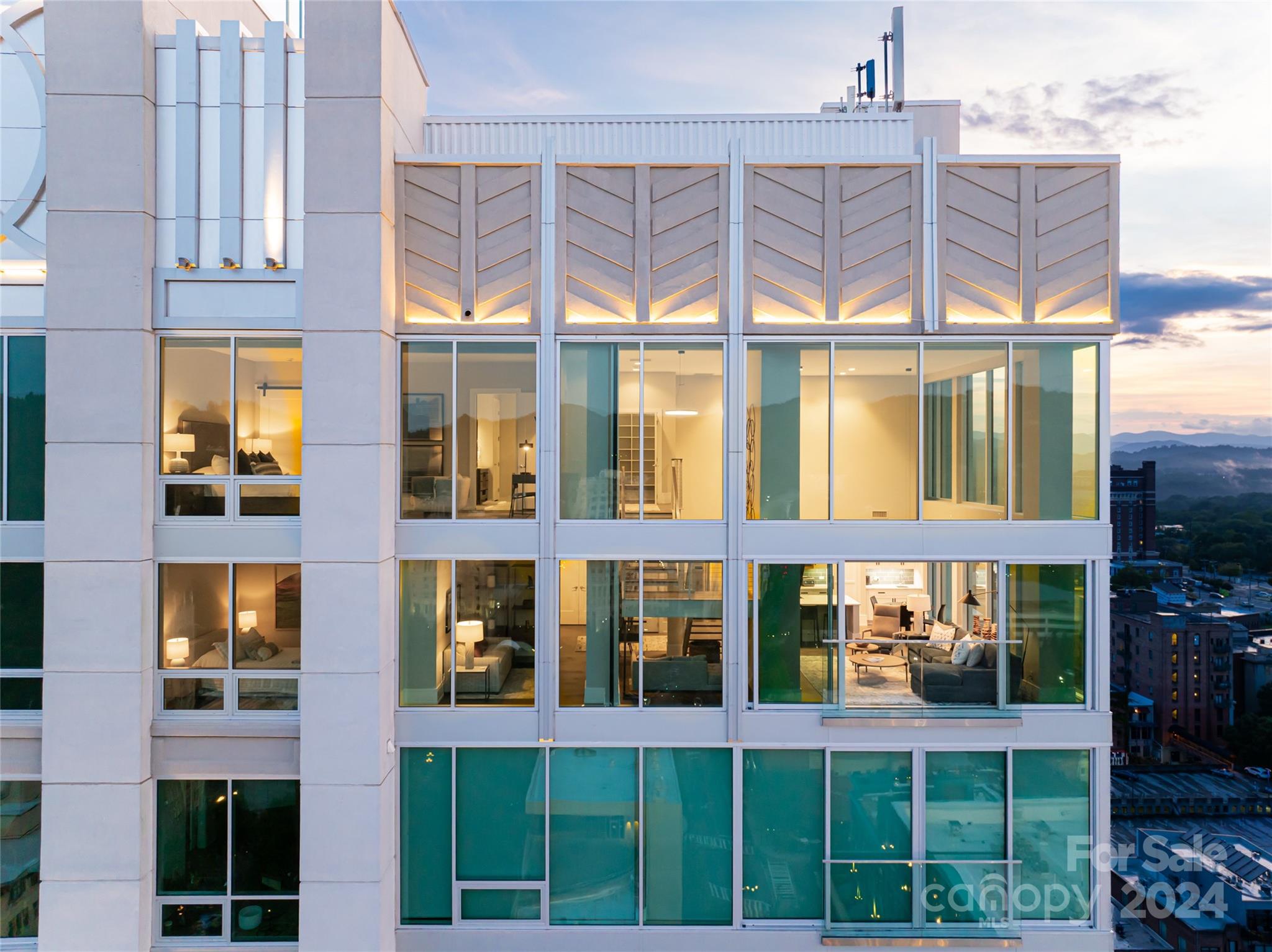 This corner penthouse spans two levels on the top floor of The Arras Residences. With floor-to-ceiling windows, it is flooded with natural light and offers views of Asheville's dramatic sunsets. The interior, designed by Allard+Roberts, features open spaces that lead to intimate nooks; two bedrooms with en suite bathrooms rival each other as chosen sanctuaries. 

In the heart of this vibrant town, this rare penthouse property—offered fully furnished—is a breathtaking stage for all Asheville has to offer.

Overlooking the I.M. Pei-designed Biltmore Building, Douglas Ellington's Art Deco City Hall, and the historic Grove Park Inn on Sunset Mountain, life at the top of Asheville's tallest building is a mountain love language. Renovated in 2019 into a luxury boutique hotel with private residences, this structure is the centerpiece of historic Pack Square in Downtown Asheville.