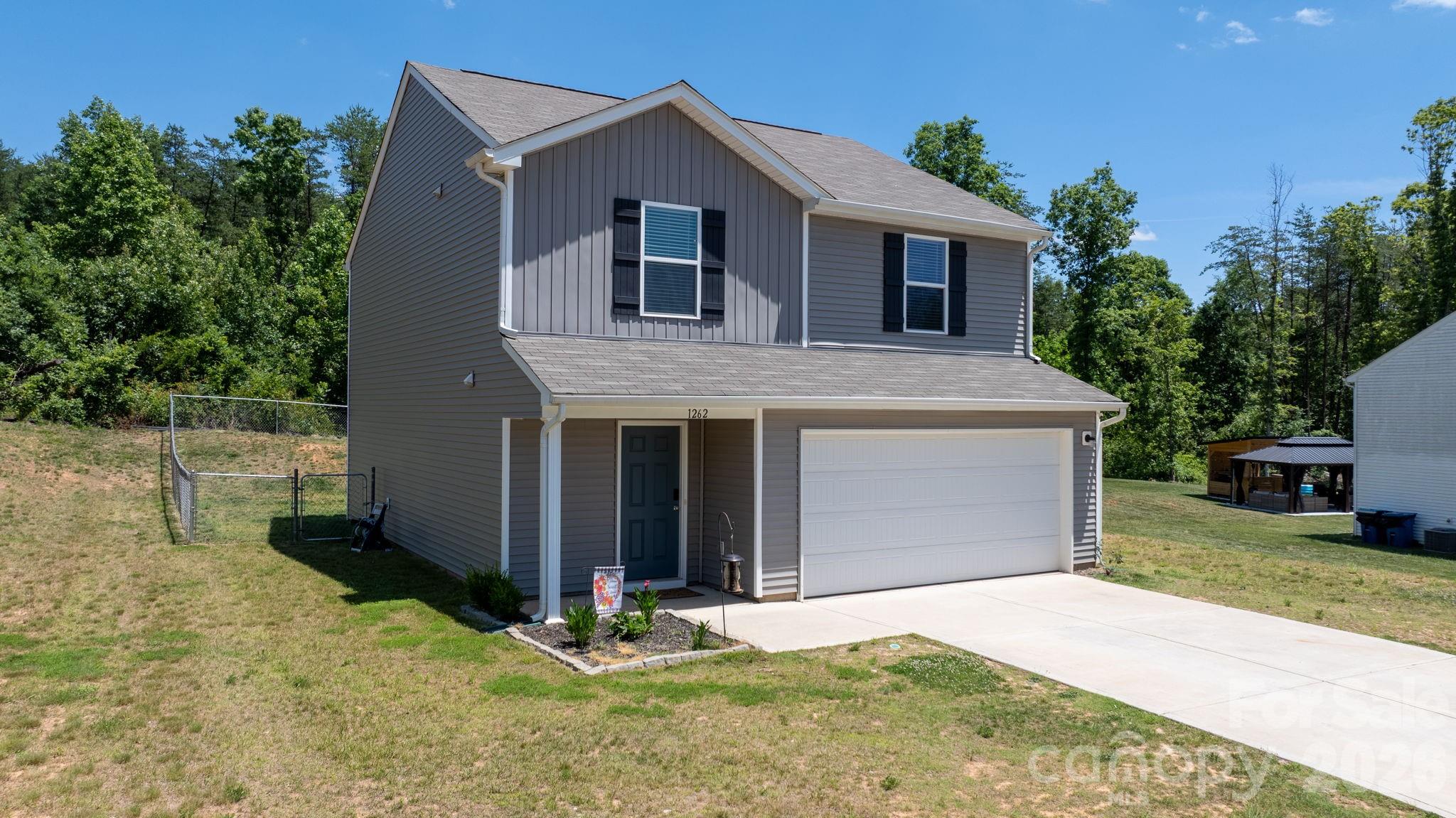 Move-in ready and better than new! This beautiful 3-bedroom, 2.5-bath home offers a spacious open floor plan designed for comfortable everyday living. The main level features a bright and inviting kitchen with white cabinetry, granite countertops, stainless steel appliances, and a pantry for added storage. Even better, the refrigerator conveys! An additional storage closet and convenient half bath complete the main level.
Upstairs, you'll find all three bedrooms, two full bathrooms, a centrally located laundry area, and a cozy sitting nook perfect for a reading space, home office, or study area. The primary suite features a private ensuite bath with double vanities, walk-in closet and plenty of room to unwind. Step outside to enjoy the fenced backyard, ideal for a play area, pets, gardening or entertaining. An attractive storage building provides extra space for lawn equipment, tools, and seasonal items. Conveniently located in the sought-after Hudson and South Caldwell High School districts, this home combines modern finishes, functional living spaces, and a fantastic location. Don't miss your opportunity to make it yours!