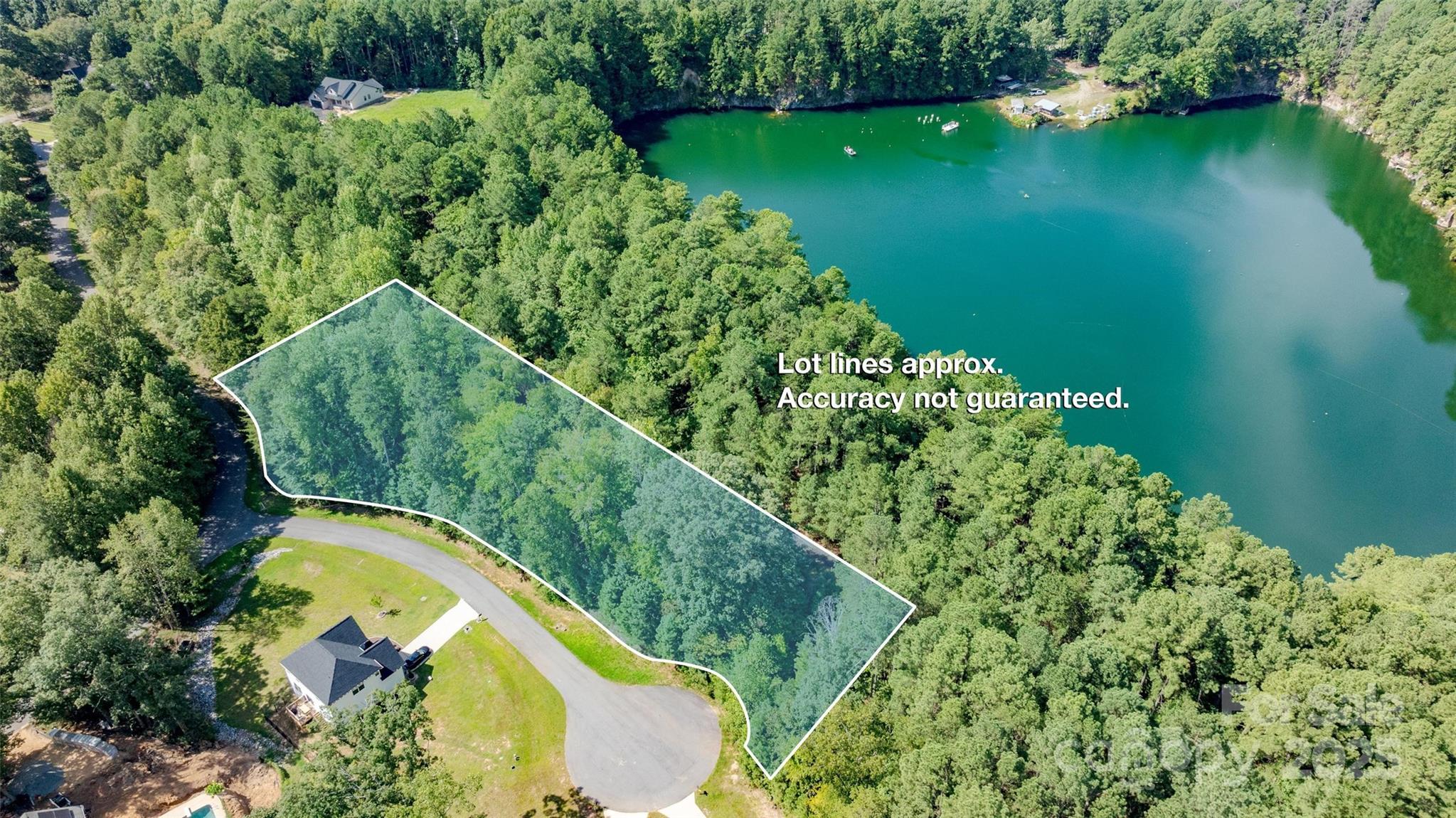 Enjoy easy access to shopping, dining, and other conveniences while being just one mile from Lake Norman’s boat ramp. With utilities already set up, building your new home here is straightforward. The property backs up to the PDRA Quarry and Lake Norman, offering added privacy. Recent nearby construction shows how this area is growing, making this land a nice choice for anyone looking to be part of a thriving lakeside community.