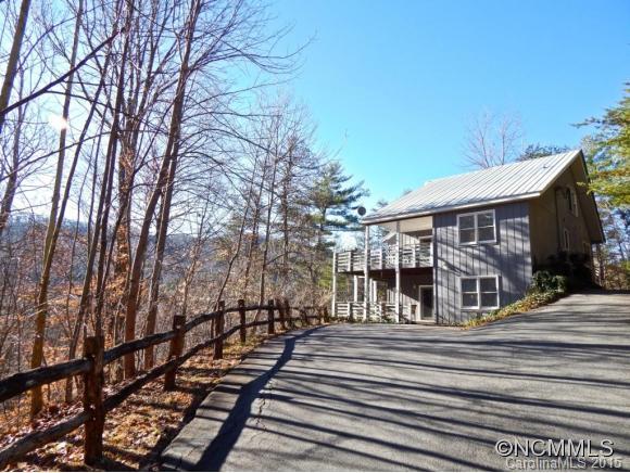 Excellent short term rental income-producing, 2-story vacation rental in Reems Creek mountains.Property is one building with 2 dwellings, upper & lower; rent both or live in one! Both come completely furnished! Situated on 1.5 acres with views of Elk Mountain. Excellent for an extended family.Country Living yet short drive to both Weaverville and Asheville and adjacent to the Blue Ridge Parkway. Must see!