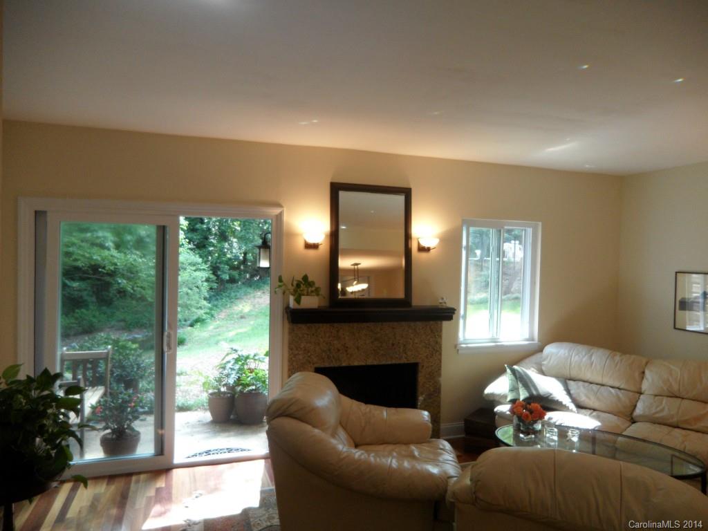 Beautifully updated Private end unit townhome backing up to private wooded area. Updated bathroom and kitchen. Wood flooring thru out. Private fenced patio with paver stones as well as patio on the back of the home. Private deck off master bedroom upstairs as well. Great location near Southpark, shopping, and restaurants.Two parking spaces