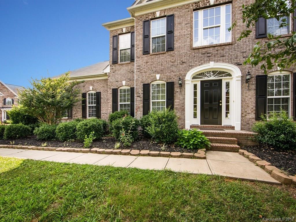 BEAUTIFUL 2 story brick home w/ 3 car side-load garage in Award Winning Fort Mill School District!! This home has all the bells and whistles, hardwood floors, designer kitchen w/ solid surface counters, SS appliances, gas cooktop, 2-story great room w/ Palladium windows and guest suite with full bath on main level. Fully fenced level backyard is perfect for family fun or entertaining friends. Close to shopping, grocery stores, restaurants & minutes from Carowinds & Charlotte.