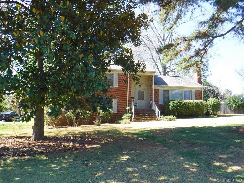 Spacious 4BR/2BA brick tri-level has a wonderful screened porch with broken tile floor. Beautiful Pine, tongue and groove paneling in great room. Detached wired building/shop. Home is in an estate being SOLD AS IS. Roof thought to be 6 or 7 yrs old, newer hot water heater. Termite bond.