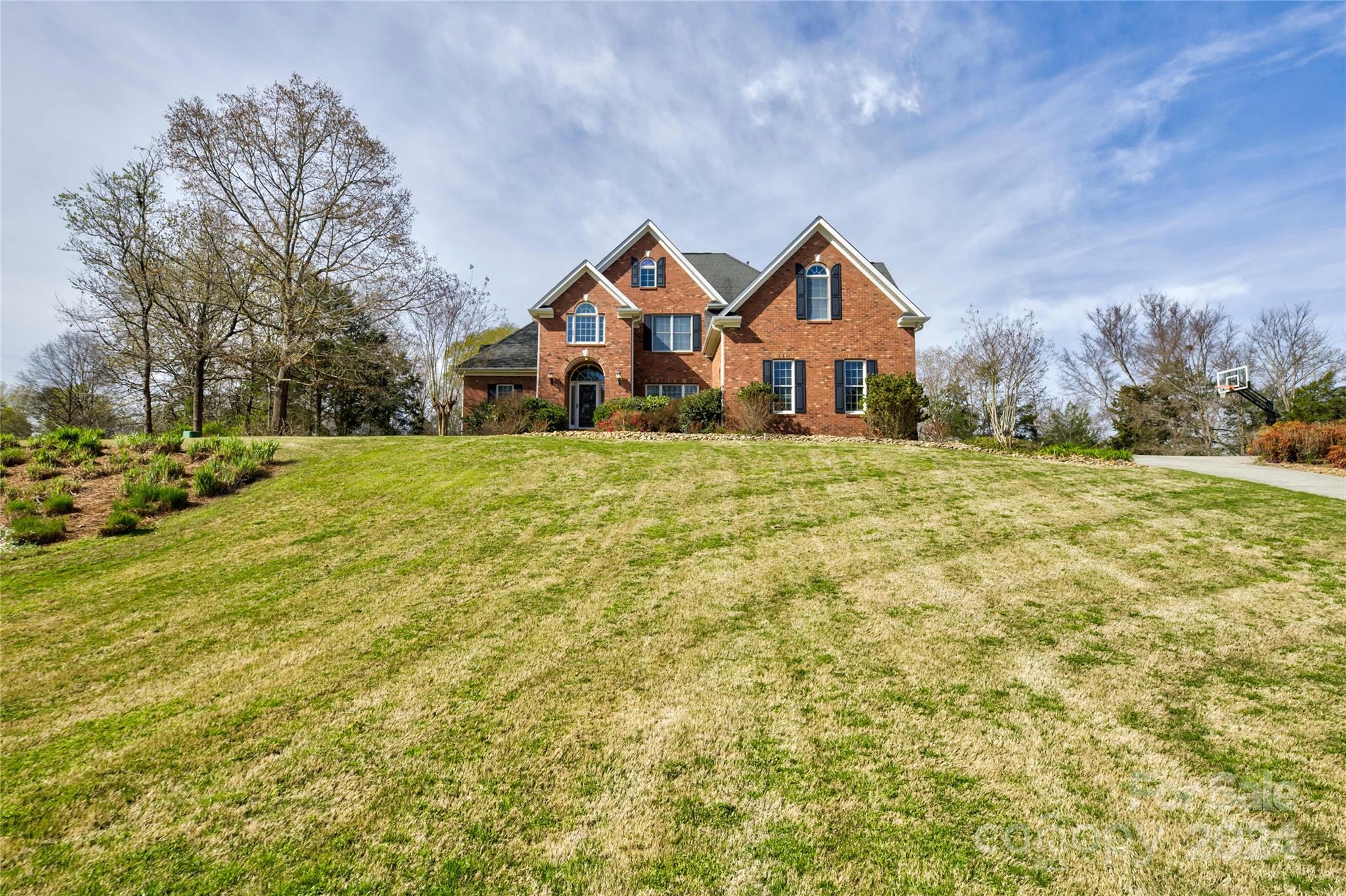 THIS BEAUTIFUL PROPERTY COMES WITH A WORKSHOP AND DEEDED BOAT SLIP IN A Lovely LAKE WYLIE FRONT COMMUNITY. Four bed/3 baths w/ open concept. Family room has vaulted ceiling. Formal dining room. Kitchen has stainless appliances, granite counter tops & gas stove. Large master suite & a guest bedroom with full bath are located on the main level. Upstairs has 2 bedrooms & bonus room. Sunroom with Sunspace vinyl windows added in 2022 along with stamped concrete patio & woodburning fireplace. Garage car vacuum, water softener, encapsulated crawl space and firepit. Attached 3 car garage with additional 1 1/2 garage in workshop. There is additional space above the workshop ready to be finished. Irrigation in front yard. HVAC 2023.