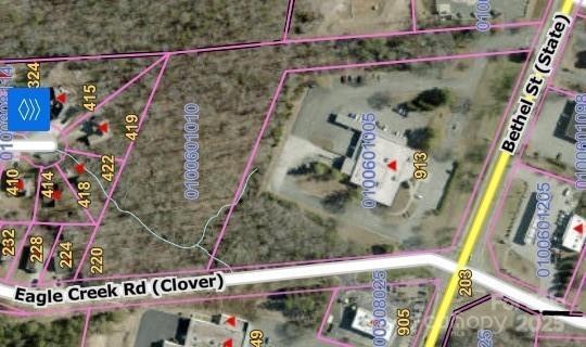 4.358 Acres behind the US Post Office Clover SC-Zoned B-2 (Commercial) in Town of Clover-Two Access points 73.10' on Bethel Street & 306' on Eagle Creek Drive-Bethel Street access is shared with USPS & Bojangles-no utilities currently on site, but access to Town of Clover water & sewer is possible subject to tap fees & cost of running lines to site location. Susan Caldwell, listing agent, is one of the shareholders of Land Grant Investments.