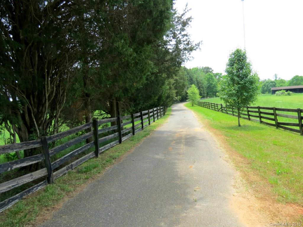 Great potential in this unique home on 36 acres.  Original log cabin has been added on to and makes a peaceful home site.  Large family room with sky lights.  Large master suite with walk-in closet.  New roof, hardwood floors, 2 fireplaces, and decks. 30x30 detached garage.  Tack shed, 4 stall horse barn, hay barn and other sheds.  Natural pond.  Fenced pasture.  Gated entrance and paved drive.  Motivated seller.   If you want horses or livestock, this is a must see.