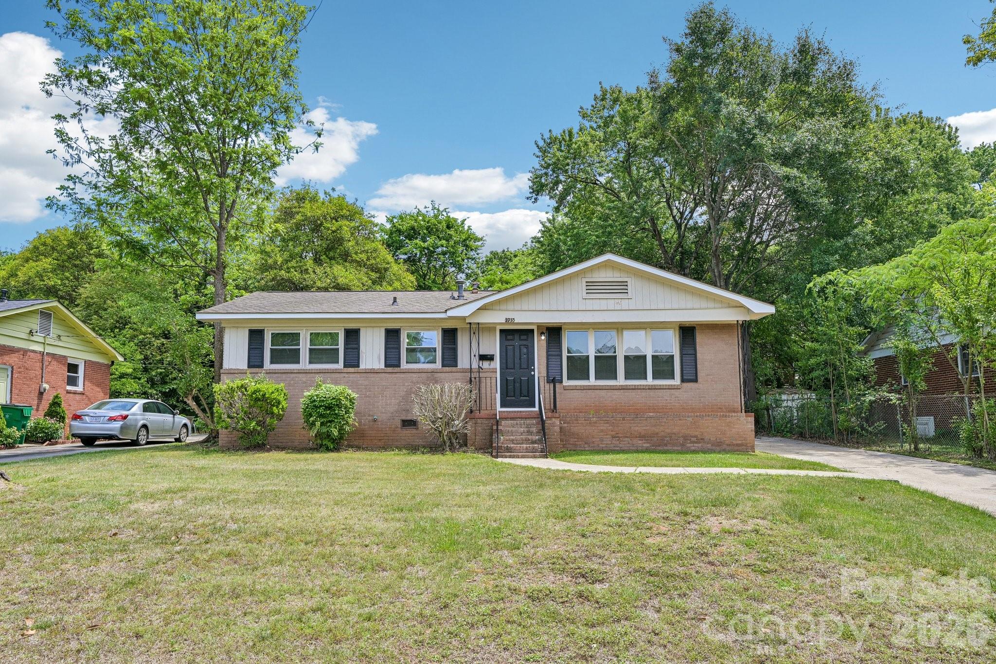 *Updated Water Heater* Welcome to 3935 Crestridge Drive, a beautifully updated brick ranch ideally located just minutes from Uptown Charlotte, South End, the airport, shopping, dining, and major commuter routes. This one-level home offers 3 bedrooms, 1 full bath, and an inviting open layout filled with natural light and modern finishes throughout. The updated kitchen features stylish cabinetry, sleek countertops, and a functional flow into the main living spaces, making everyday living and entertaining effortless. Spacious bedrooms and refreshed interior spaces create a move-in ready feel, while the large, fenced, level backyard offers endless possibilities for outdoor living, gardening, or pets.  Situated in an established neighborhood with mature trees and convenient access to everything Charlotte has to offer, this home combines comfort, location, and value in one attractive package.