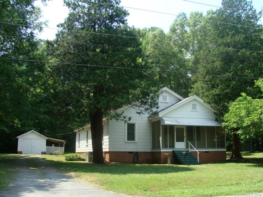 Extra clean, three bedrooms, one and a half baths, dining room, living room and den, beautiful hardwoods, laundry room, rocking chair screened in front porch. Large wooded lot, detached one car garage with wired work shop, and wired 8X16 storage building.  New gas pack in 2011, new vinyl clad windows in 2007.  Wood burning fireplace in den, non-working fireplace in living room. 

                                             Seller provided one year home warranty.