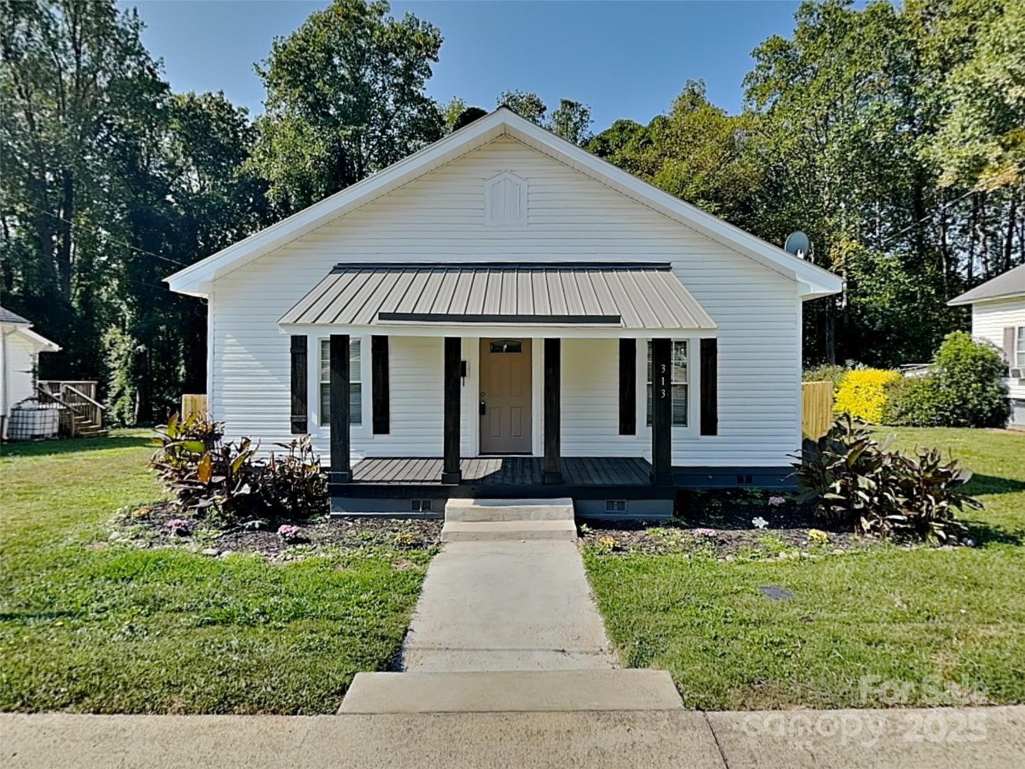 Welcome home to this remodeled property in Mooresville Mill Village! Step inside to a move-in ready home with fresh paint, updated flooring in most rooms, and brand new stainless steel appliances! The kitchen also boasts new shaker cabinets with a quartz countertop and undermount sink. The primary suite features a generously sized room and walk-in closet with an updated en-suite including a new tiled shower and stylish vanity with new hardware. Enjoy the outdoors in the spacious, fully fenced backyard, perfect for entertaining family and friends. Schedule your visit today!