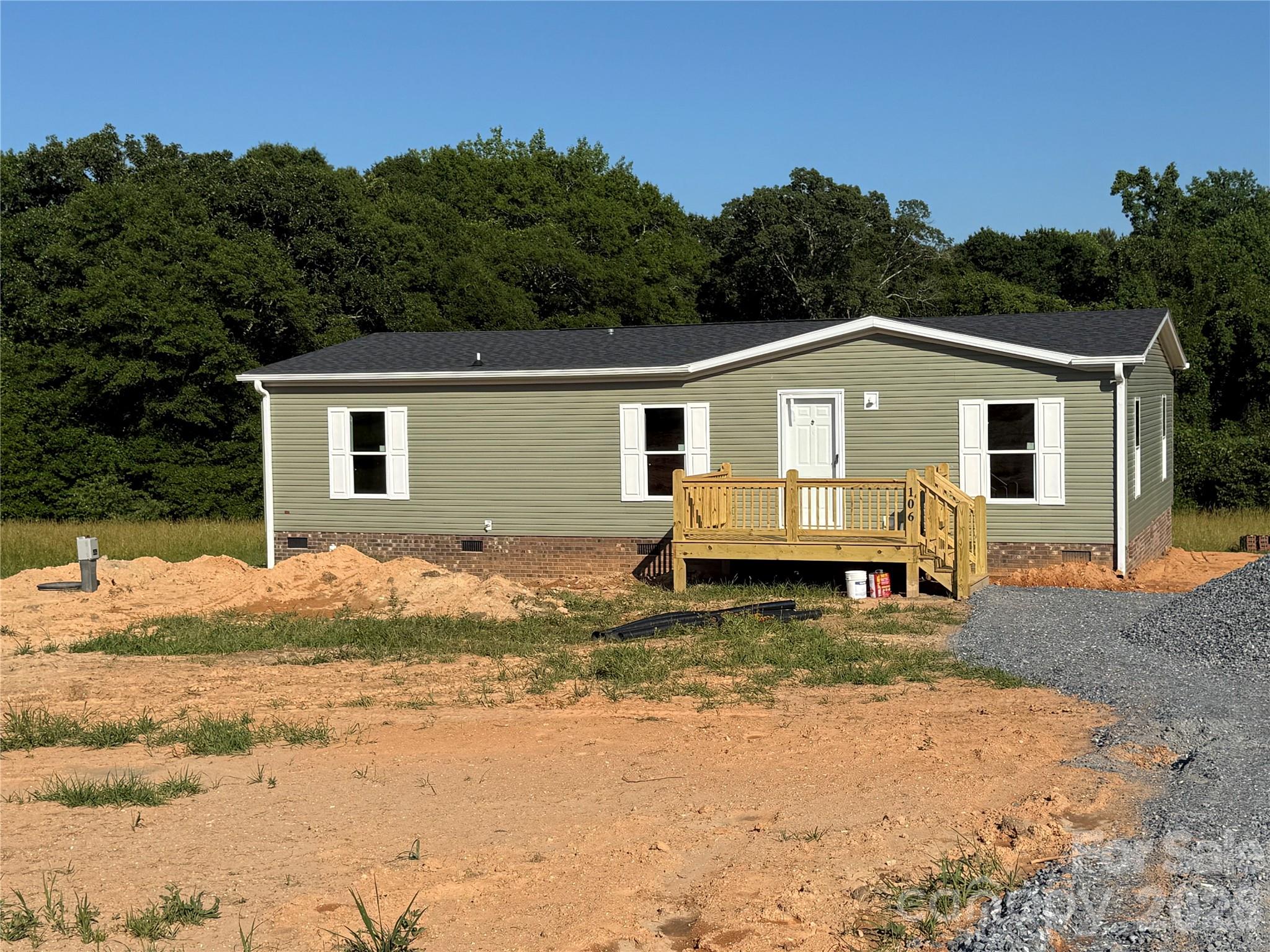 Brand new 3 bedroom 2 bath vinyl home on approximately 1 acre lot on Advent Drive in the countryside in Grover area of Southern Cleveland County. The home is built with an open floor plan with LVP flooring and neutral colors throughout. The living room is very spacious. The kitchen has a center island with breakfast bar. Primary suite has a double vanity, soaking tub, walk-in shower and walk-in closet. Bedrooms 2 and 3 have walk-in closets. The home has a front deck. There is also a rear deck, perfect for grilling out or just relaxing and enjoying the outdoors. Make this your new dream home!