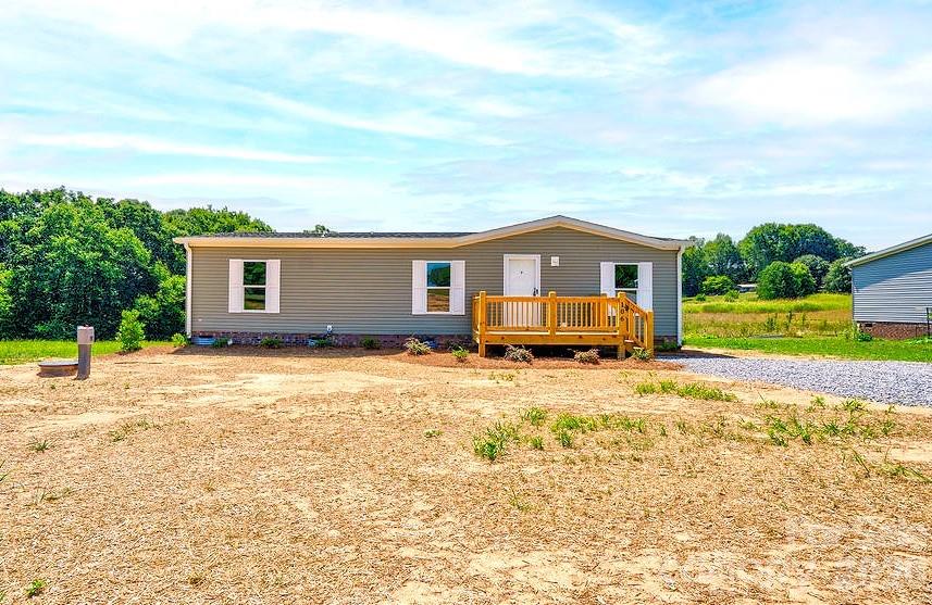 Brand new 3 bedroom 2 bath vinyl home on approximately 1 acre lot on Advent Drive in the countryside in Grover area of Southern Cleveland County. The home is built with an open floor plan with LVP flooring and neutral colors throughout. The living room is very spacious. The kitchen has a center island with breakfast bar. Primary suite has a double vanity, soaking tub, walk-in shower and walk-in closet. Bedrooms 2 and 3 have walk-in closets. The home has a front deck. There is also a rear deck, perfect for grilling out or just relaxing and enjoying the outdoors. Make this your new dream home!