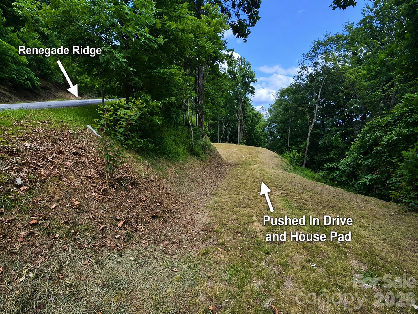 BUILDABLE MOUNTAIN LAND in a gated Waynesville subdivision with major site prep already completed. Located at 175 Renegade Ridge in Creekstone, this 2.56-acre homesite offers a rare head start for buyers looking to build in the mountains of Western North Carolina. The driveway has already been pushed in, and a house pad has been cleared and prepped where the sellers had planned to build before deciding to go a different direction.

Creekstone is a gated mountain community in Waynesville, NC known for its peaceful setting, paved access, wide well-maintained roads, and attractive neighborhood feel. Unlike many mountain lots that still require extensive clearing and access work, this property already offers usable, buildable land with practical access in place. The roads are wide enough for two vehicles to pass comfortably, adding everyday convenience for future owners, guests, contractors, and service providers.

The sellers also have approved house plans and architectural drawings available for separate purchase. The planned home was approximately 1,900 square feet with 3 bedrooms and 2.5 bathrooms, offering a strong vision for how the property could be used. Per the covenants, the minimum build size is 1,200 square feet, giving buyers flexibility while maintaining the residential character of the subdivision. Well and septic permits were previously pulled but canceled before installation.

Located approximately 20 minutes from downtown Waynesville, this Creekstone lot offers convenient access to shopping, dining, medical services, schools, local festivals, Lake Junaluska, Maggie Valley, the Blue Ridge Parkway, Asheville, hiking, fishing, skiing, and the outdoor recreation that makes Haywood County and the Smoky Mountains so desirable.

Whether you are planning a full-time mountain residence, a second home, or a future Western North Carolina mountain retreat, 175 Renegade Ridge offers a prepared homesite, gated community setting, paved road access, and true buildable mountain land near Waynesville, NC.