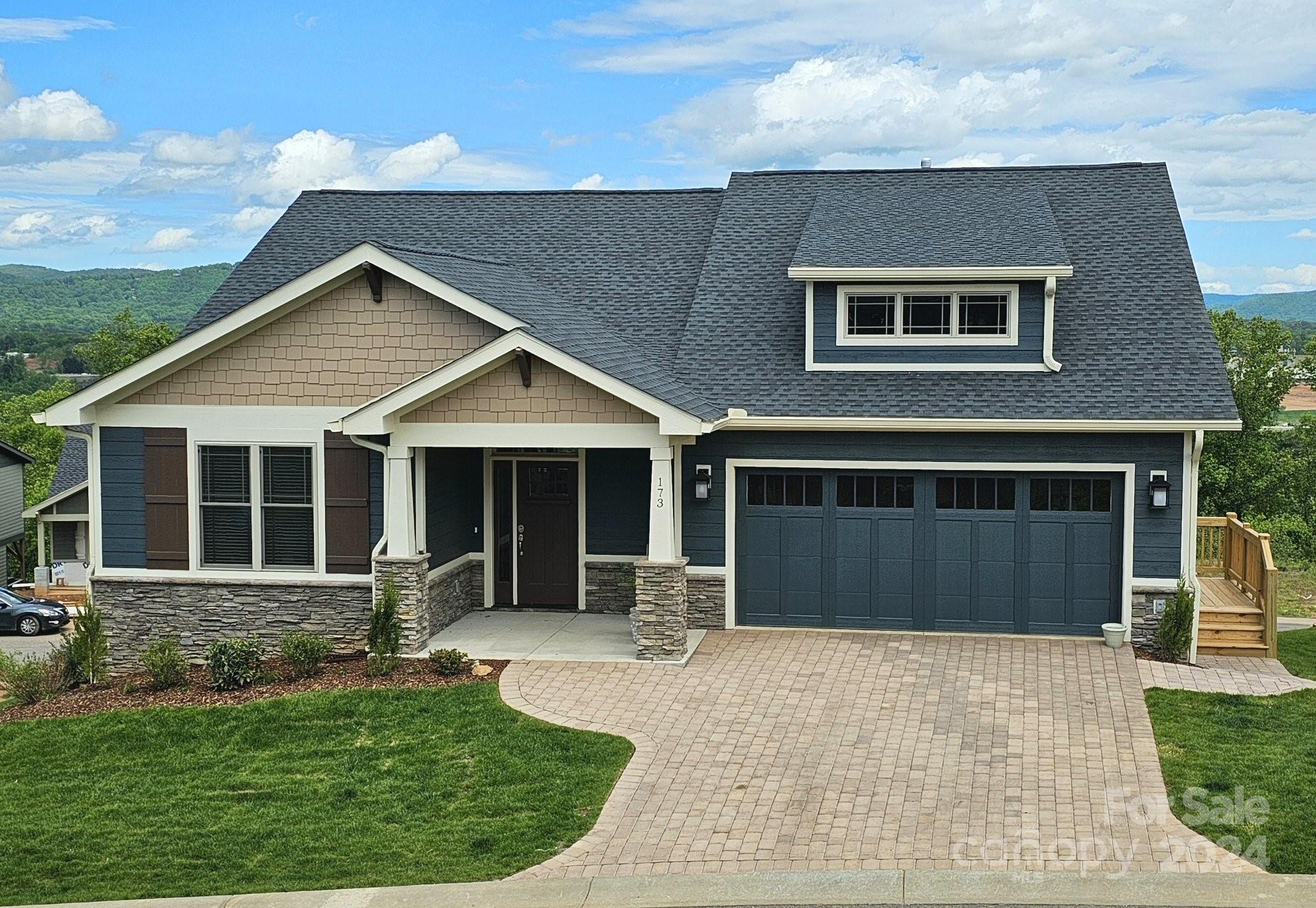 NOW UNDER CONSTRUCTION - This Express Build 150 home (approx 150 days to close) has the foundation in place and is just waiting for you to personalize your new home to suit your own style using our on-site selection of interior finishes.  Property listed long before start of construction. This Pinnacle 1 is a low-maintenance 3-level home with main-floor, open floor plan living. You'll find 3 bedrooms; 4 bathrooms; a deck with mountain views; a huge, full-light lower level rec room that walks out to a patio; vaulted & tray ceilings; granite countertops; hardwood floors; gas fireplace; multi-zoned HVAC; tankless water heater; frameless master shower door; & NO YARD WORK. Community includes clubhouse, fitness center; neighborhood pool; walking trails. Full city amenities with underground utilities, city sewer & water, yet county-only real estate taxes. Convenient to Biltmore Park, only 5 minutes! NOTE: All photos are of similar model.