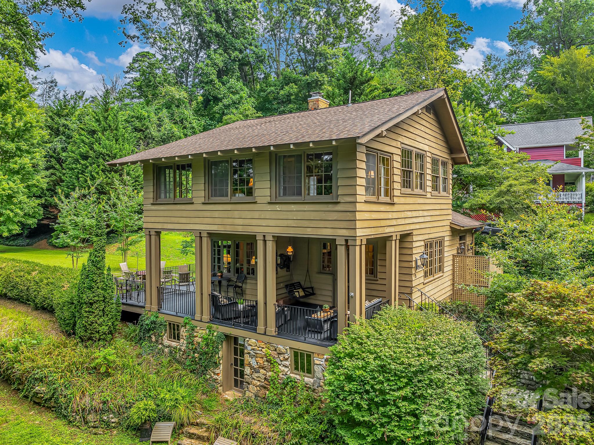 Seize a once-in-a-lifetime opportunity to make this lovingly maintained historic Saluda home yours. Offering a perfect blend of timeless charm & modern luxury, this exceptionally private yet conveniently located property is just steps from downtown shops, restaurants, events & more. Completed in 1904, the home exudes authentic character, showcasing original heart pine floors, 9'+ ceilings & abundant antique windows that invite the outside beauty in. Imagine evenings on the front porch, feeling gentle mountain breezes & watching fireflies dance as faint music drifts up from town. The large private garden offers a serene escape, perfect for outdoor games, entertaining family & friends on the open deck, or even the possibility for a guest house.  Can convey furnished at no extra cost. This rare offering presents a unique chance to own a significant piece of Saluda's history in which to write your own next chapter of fine mountain living. Come see yourself by scheduling a showing today. Priced competitively!