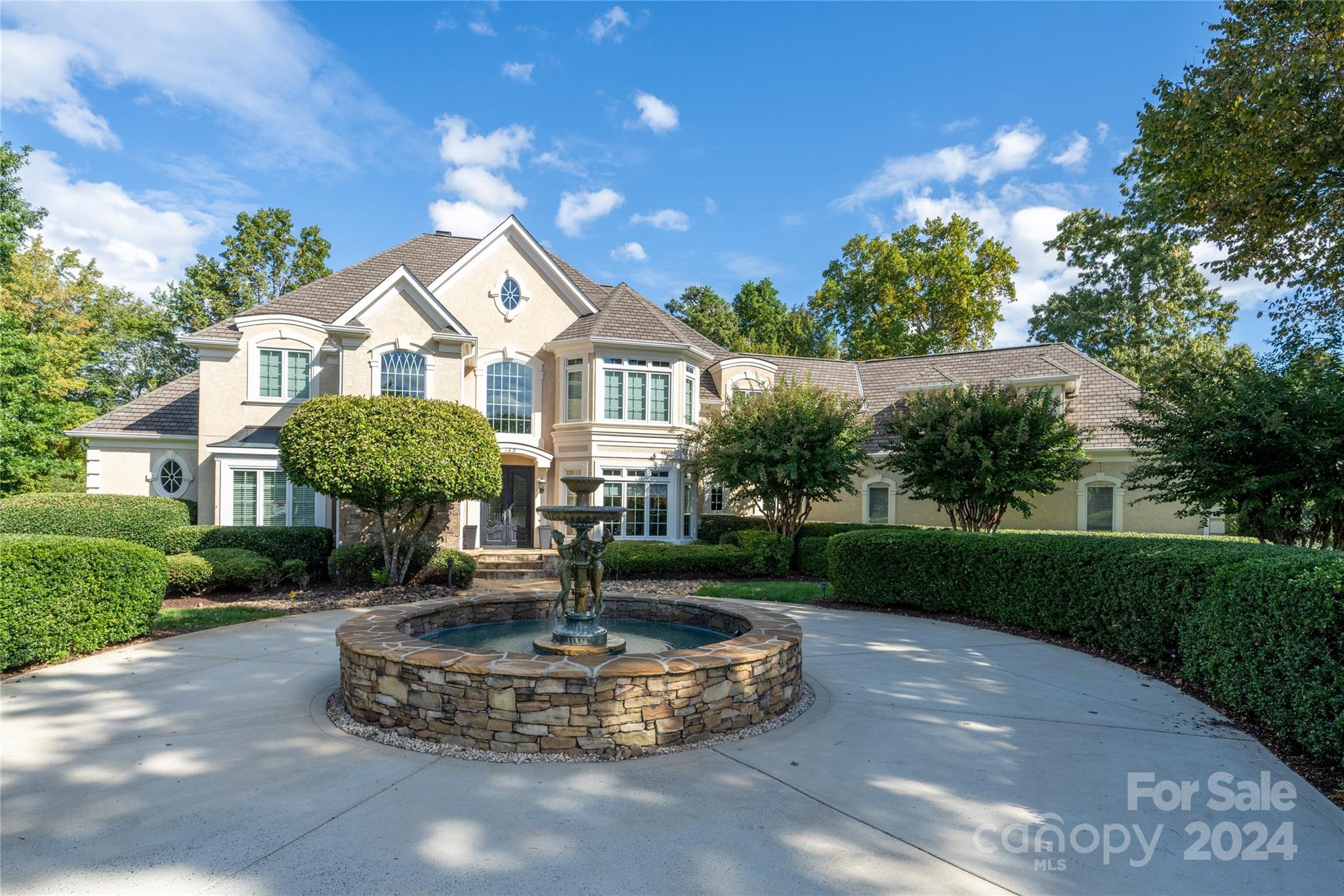 Stunning & Elegant, Waterfront Retreat with Pool/Spa, Private Dock/Pier with Boat Slip, located in highly sought after The Point! Tranquil Fountain on property greets you upon arrival! Step into Grand Foyer with High End Finishes & Architectural Details (including beautiful archways) throughout! Huge Windows provide Amazing, Outdoor Living & Water Views! 3 gas fireplaces throughout! Gourmet, Chef's Kitchen offers granite counters, double island, top of the line, stainless steel appliances, custom lighting & custom, tile back splash! Keeping Room off Kitchen with deep, wood, tray ceiling! Slate balcony off Kitchen with built in gas grill! Spectacular, Owner's Suite on main level features large windows for lake views, Luxury Bath & huge, custom, walk in closet (with Amazing closet system)! Luxury Bath with custom, dual vanity, soaking tub, large, walk in, tile shower, custom chandelier & heated, tile flooring! Bonus Room on upper level with Wet Bar area (including beverage refrigerator)!