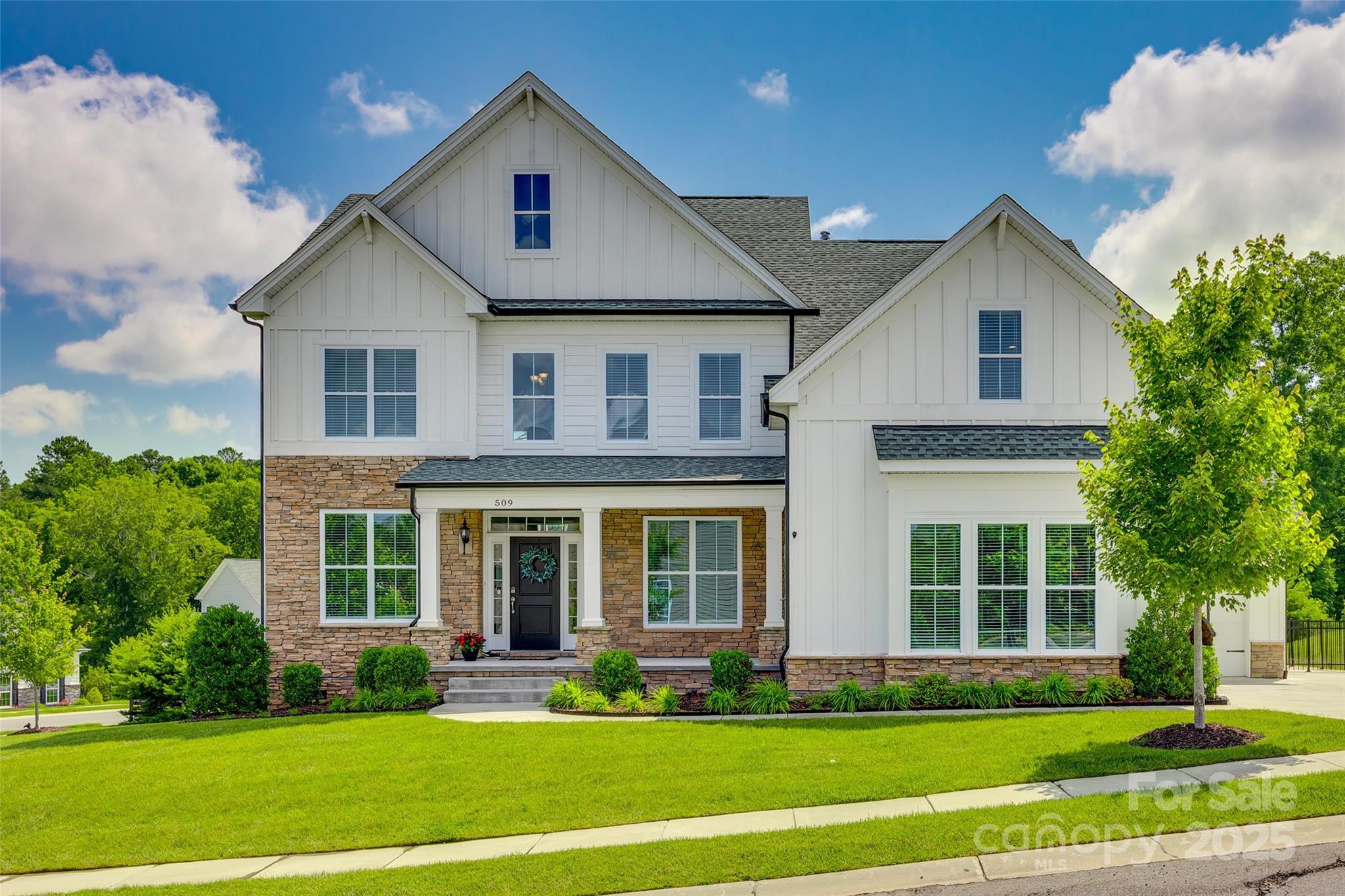 Welcome to the Manors at Lake Ridge in Tega Cay! This beautifully appointed 5BR home sits on a desirable corner lot and offers access to amenities including a clubhouse, pool w/slide, sports court, playground, tennis courts, and scenic trails. The main level features a guest BR, dedicated dining, and private office w/French doors. The gourmet kitchen boasts SS appliances, gas range, quartz counters, large island, pantry, and built-in wine fridge. Sliding glass doors lead to a screened porch w/decorative wood ceiling and wooded views. Upstairs, the luxurious primary suite includes a spa-like bath w/soaking tub, double vanity, tiled shower w/bench, vaulted ceiling, WIC, and a 195 sq ft heated/cooled flex room ideal for office or dressing room. Bonus room, 3-car garage, irrigation, and fenced paver patio w/fire pit complete the home. Ideally located near Lake Wylie, Baxter Village, Catawba Park, and award-winning Fort Mill schools—offering the perfect blend of convenience and lifestyle.