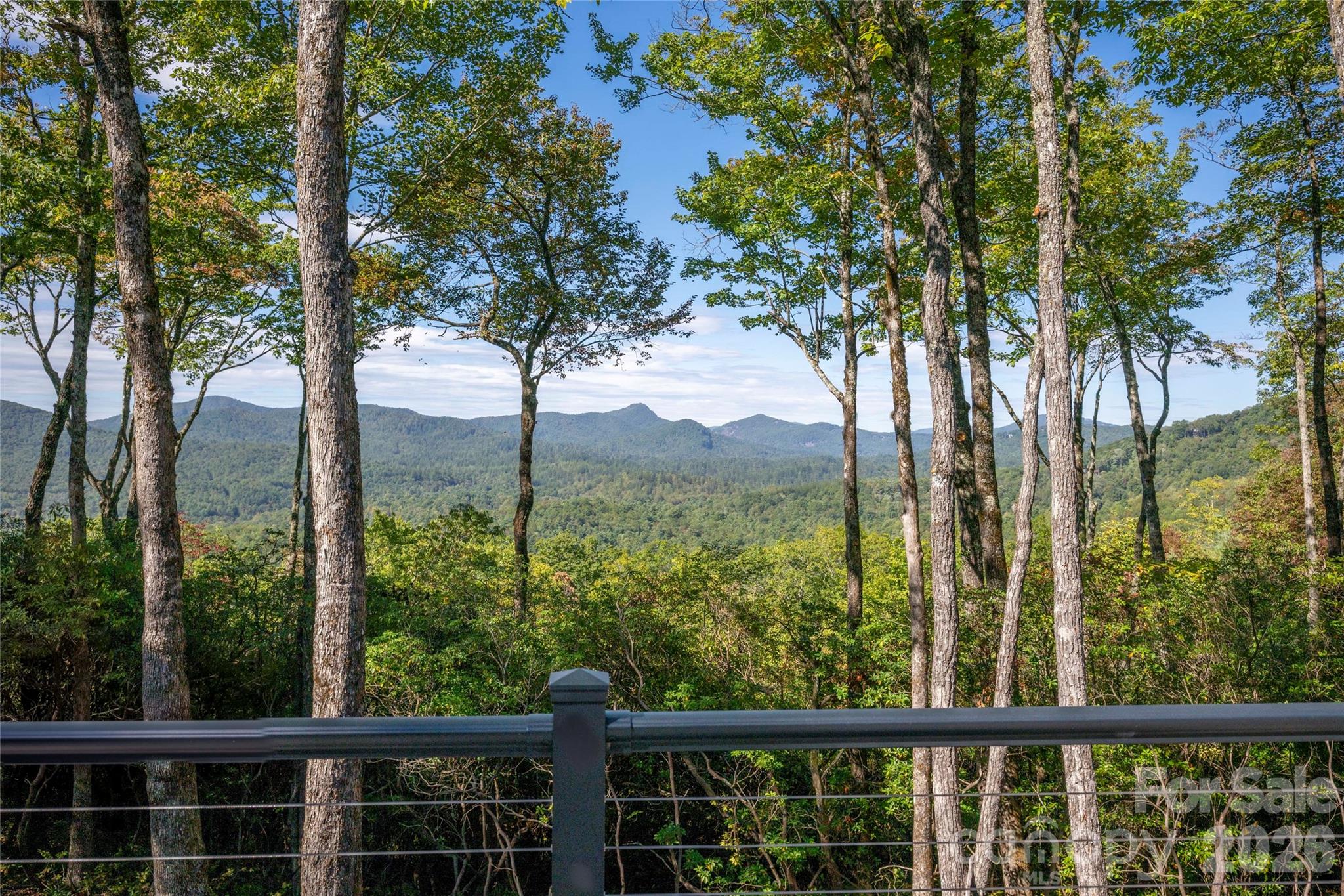 Discover the perfect blend of privacy, security, and natural beauty at 519 Eagle Drive. With minimal residents along Eagle Drive, this serene estate offers unmatched peace and seclusion within the only gated section of Lake Toxaway Estates. Enjoy breathtaking sunset views of Chimney Top Mountain and the surrounding Blue Ridge landscape from your 3,500-ft elevation—high enough for cool, comfortable temperatures without the heavy fog or weather swings of higher elevations. Less than a mile from Hwy 64, the property is ideally located just 5 minutes from the LTCC Fitness and Learning Center, 8 minutes from the Lake Toxaway Country Club, and 45 minutes from Asheville Airport. This spacious estate lot offers room for a guest house to be built on property. Outdoor enthusiasts will love being close to hiking trails and local waterfalls. Privacy, convenience, and stunning vistas—this is Lake Toxaway living at its finest. Membership to LTCC is based on application and availability.