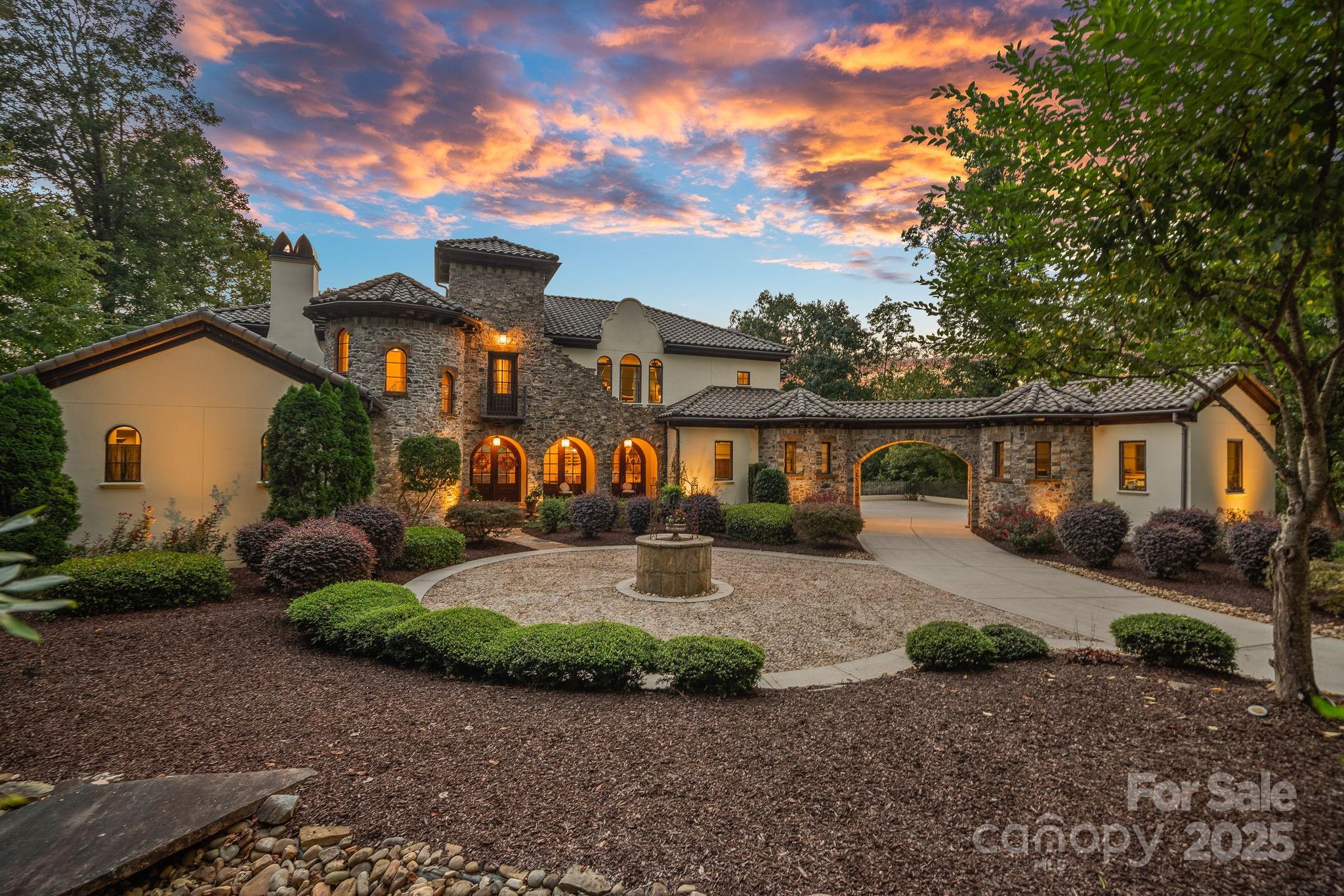 Experience luxury living in this stunning Tuscan-style villa on Lake Norman. Designed with the highest attention to detail, this custom home features two chef’s kitchens with top-of-the-line appliances, soaring ceilings, and dramatic curved glass walls showcasing panoramic views of the saltwater pool and lake. Interior highlights include reclaimed wood beams, a limestone spiral staircase, and solid knotty wood doors throughout. Entertain with ease in the state-of-the-art media room, stay active in the private gym, unwind in the steam shower, or dine al fresco complete with a pizza oven. A true masterpiece on the lake!