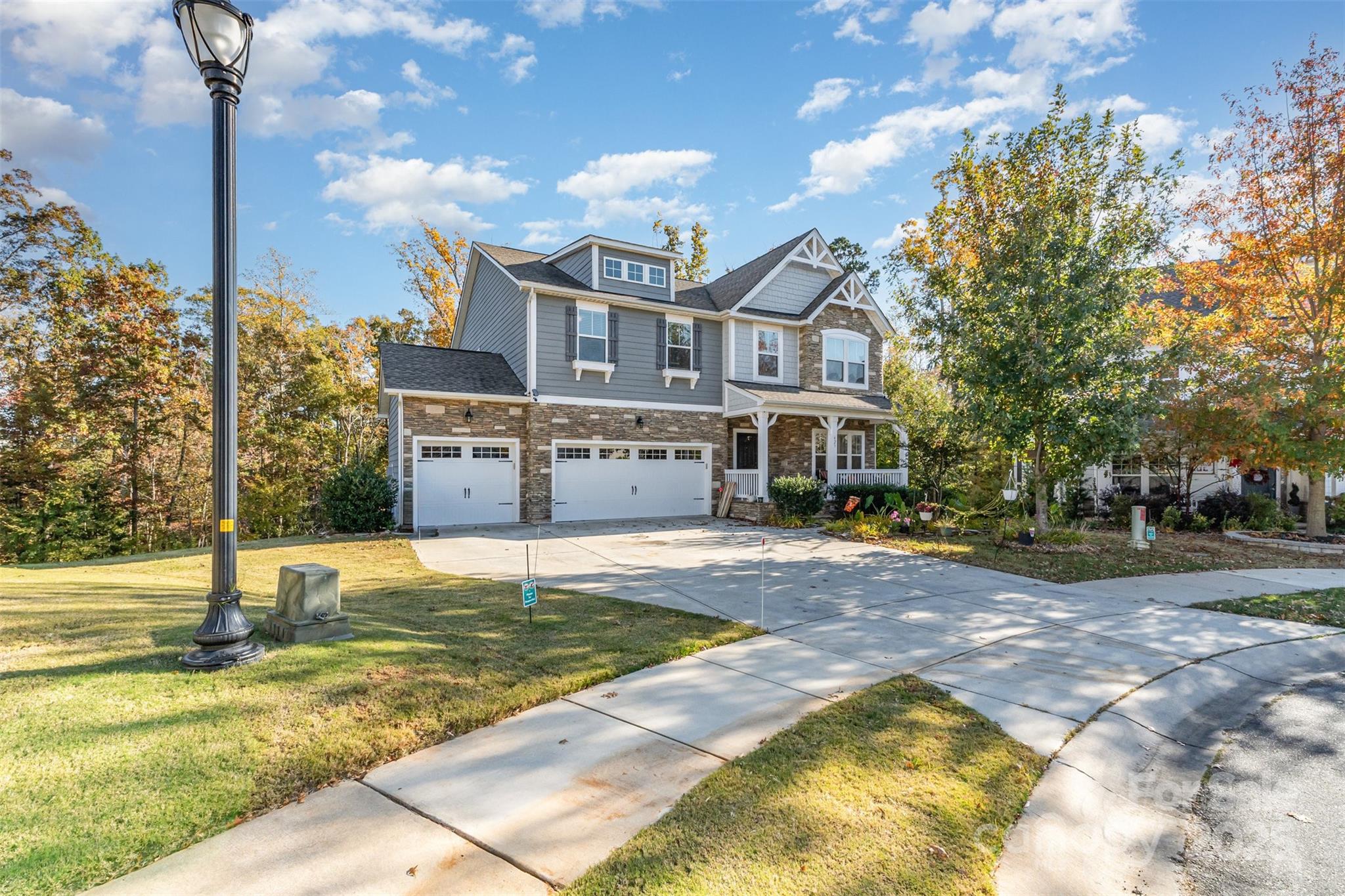 Luxury multigenerational living with 2 full kitchens and 2 laundry rooms with a separate walkout basement entrance; This property is nestled at the bed of a cul-de-sac, backing up to a private wooded backyard, and the full sized walkout basement offers unlimited potential to anyone who could use a little extra space to entertain guests on game day. Fitted with features such as an in-ground irrigation system, walk-in closets throughout, bonus room upstairs, and a spacious primary suite with a garden bathtub, sitting room AND walk-in rain shower; 423 Crisfield Ct has everything you need. Community amenities include playground, clubhouse, fitness center, lake access, and resort-style community pool.