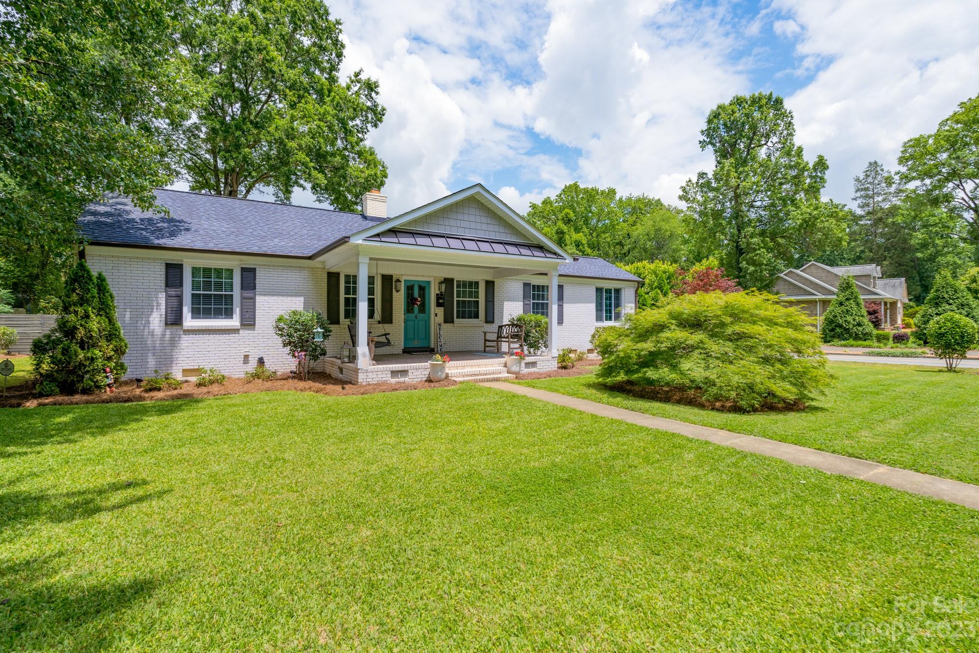 Southern hospitality awaits you in this classic one-story home with an effective mixture of historic charm and modern amenities! The spaciousness of this home allows for so many options with two primary suites! There are two additional bedrooms, living room with fireplace, family room, and an open kitchen with beautiful marble countertops and stainless-steel appliances overlooking the dining room! Relax with your morning coffee or spend the evening hours in one of the two sunrooms (one currently used as a second dining room) with plenty of natural light. Custom built-ins provide both beauty and additional storage in this amazing home. The interior is sure to impress you, but don’t forget to check out the backyard with a covered patio with a wonderful entertainment space enclosed by an attractive privacy fence. A few of the recent updates over the past several years include: paint, sunroom Anderson slide windows, pipes/water main, and HVAC.  Located on the coveted Myrtle Drive!
