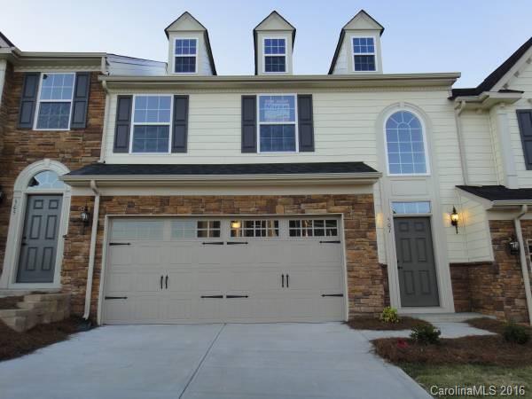 Beautiful townhome w/ upgrades throughout, including hardwoods, granite in kitchen & SS appliances with fridge & washer/dryer staying for tenant use. Open floorplan w/ master on main. Large master bath w/ dual vanity, huge shower w/ 2 showerheads & walk-in closet. 2 story great room. Loft & 2 spacious bedrooms upstairs with views of Lake Wylie. Patio in rear. Tega Cay offers paved walking trails, beach volleyball, beach access for kayaks, playgrounds. Fort Mill schools. Amazing opportunity!