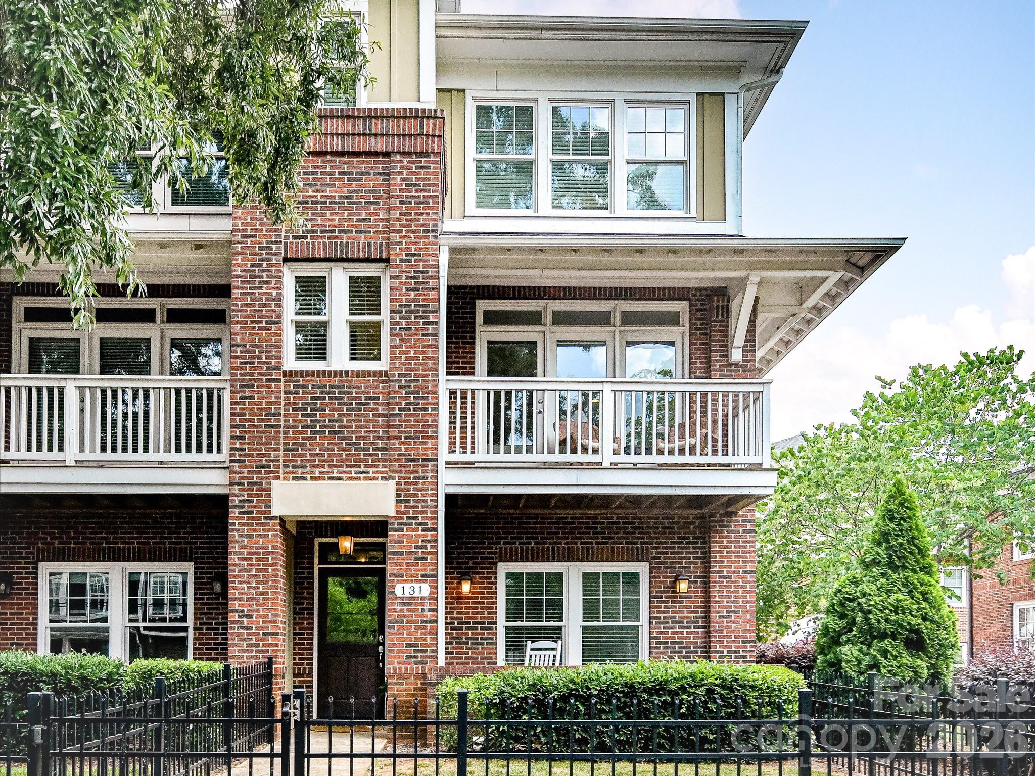 End-unit 3-bedroom, 3.5-bathroom townhome in the vibrant Wesley Heights neighborhood! Perfectly situated in one of Wesley Heights’ most convenient locations, this home blends neighborhood charm with modern style. A private fenced front yard and a covered front porch welcomes you into the main level, which features a private bedroom and full bathroom ideal for guests. You’ll also appreciate the attached two-car garage with ample storage space. Upstairs, the open-concept kitchen and living area are filled with natural light. The inviting kitchen includes stainless steel appliances and an oversized island perfect for entertaining. A dedicated workspace nook provides the ideal spot to work from home without sacrificing bedroom space. Just off the living area, the front porch offers a relaxing place to enjoy your morning coffee. On the third floor, the primary suite is tucked away for added privacy and features an en-suite bathroom and spacious walk-in closet with the primary bath including a double vanity and generous counter space. An additional guest bedroom on this level captures gorgeous views of Uptown’s skyline. Enjoy easy access to neighborhood favorites like Rhino Market and Town Brewing, or hop on the Greenway just moments from your doorstep. The Gold Line streetcar nearby provides convenient access to Bank of America Stadium and Uptown. Urban living at its finest awaits in this stylish, updated townhome!
