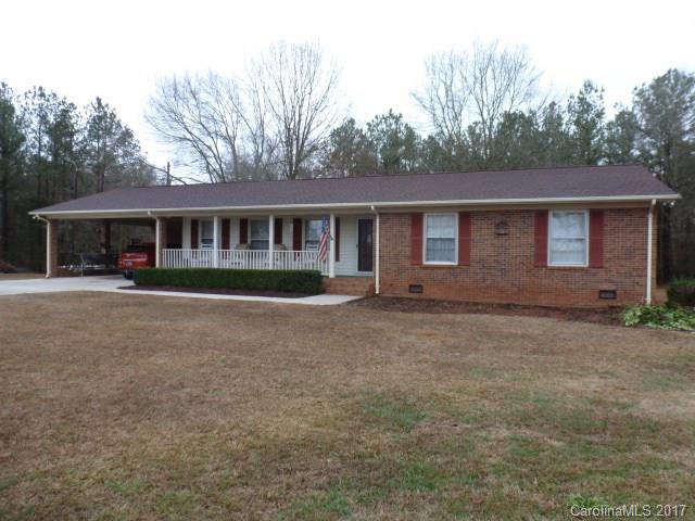Need peace and quiet, try country living, in this all brick ranch home on 6.24 acres. Home features oversized greatroom with fireplace/gas logs, great kitchen with all stainless appliances, 3BR, 2BA, lg laundry room. Dbl attached carport, outbuilding, and 2 stall barn. Well on property. Lots of room to play, garden, have horses bring them.