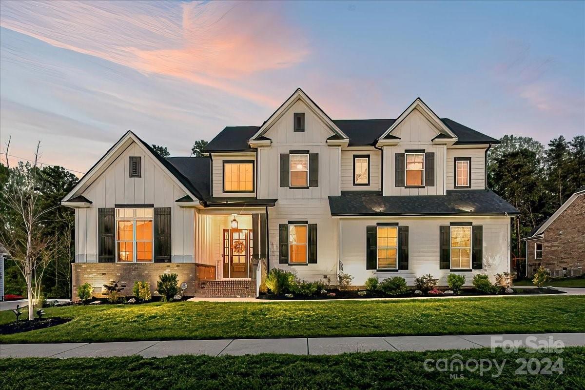 Your Dream Home awaits you! Stunning Home w/Farmhouse Exterior Colors situated on Private Lot located in Award winning Fort Mill Schools! Enter through the Custom Front door to Soaring Ceilings & Architectural Features. Amazing Office w/Vaulted Ceilings! Oversized Dining Rm w/extended Height & Tray Ceiling! Wide Plank Wood Flrs! Impressive Kit w/DBL Stacked White Cabinets w/Soft Close, Dbl Wall Ovens & Micro. Wall Mounted SS Vent Hood, Farmhouse Sink, Custom Tiled Backsplash, Expanded Island! Quartz Counters! Butler's Pantry w/Bev Refrig. Kit overlooks Great Rm w/Built-in Shelving & Stone FP! Primary-Main w/Tray Ceiling, Custom Walk-in Closets, & Glamorous Bath w/Separated Vanities, Garden Tub & Huge Walk-in Shwr w/Bench seat. Upper Level Hall w/Wood Flrs. Bonus Rm w/Barn Door & Walkin Storage. Generously sized Bdrms. Outdoor Living too! Custom Patio w/Subterranean Firepit, Covered Rear Porch, Fenced Yard! Full Irrigation, Extended driveway, Painted/Finished Garage w/Epoxy Garage Flr.