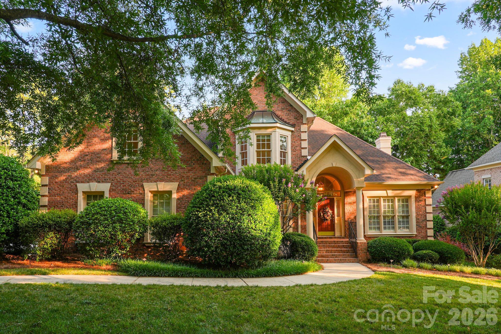 Some neighborhoods are known for their homes. Others are known for the lifestyle they create.
Located within Ballantyne Country Club, this home offers the opportunity to enjoy one of South Charlotte's most established country club communities with convenient access to neighborhood amenities, recreation, and everyday conveniences.

Inside, the floor plan balances functionality with comfortable everyday living. A main-level primary suite and flexible living space for a home office, sitting room, or additional entertaining area provide flexibility for today's lifestyles, while the recently renovated kitchen serves as the centerpiece of the home. Thoughtfully redesigned in 2024, the space features Thermador appliances, a Freedom induction cooktop, steam oven, wine refrigerator, soapstone and marble countertops, an integrated marble sink, updated backsplash, refinished cabinetry, and under-cabinet lighting.

One of the first things you'll notice is how much natural light fills the home. Large windows in the two-story living area draw your attention immediately and give the space an open, welcoming feel throughout the day. Refinished hardwood floors and updated lighting throughout the main level add warmth and character, creating spaces equally suited for everyday living and entertaining.

Beyond the home itself, Ballantyne Country Club continues to be one of South Charlotte's most sought-after communities, where recreation, connection, and everyday convenience are part of daily life. Neighborhood amenities include sidewalks, walking trails, playgrounds, dog parks, and neighborhood social events. Residents also have the opportunity to join Ballantyne Country Club through optional golf, racquet, or social memberships, providing access to golf, tennis, pickleball, swimming, fitness, dining, and a full calendar of club events and activities. Just minutes from shopping, dining, entertainment, major employment centers, and everyday necessities, this location offers the lifestyle that continues to make Ballantyne one of Charlotte's most desirable places to call home.
