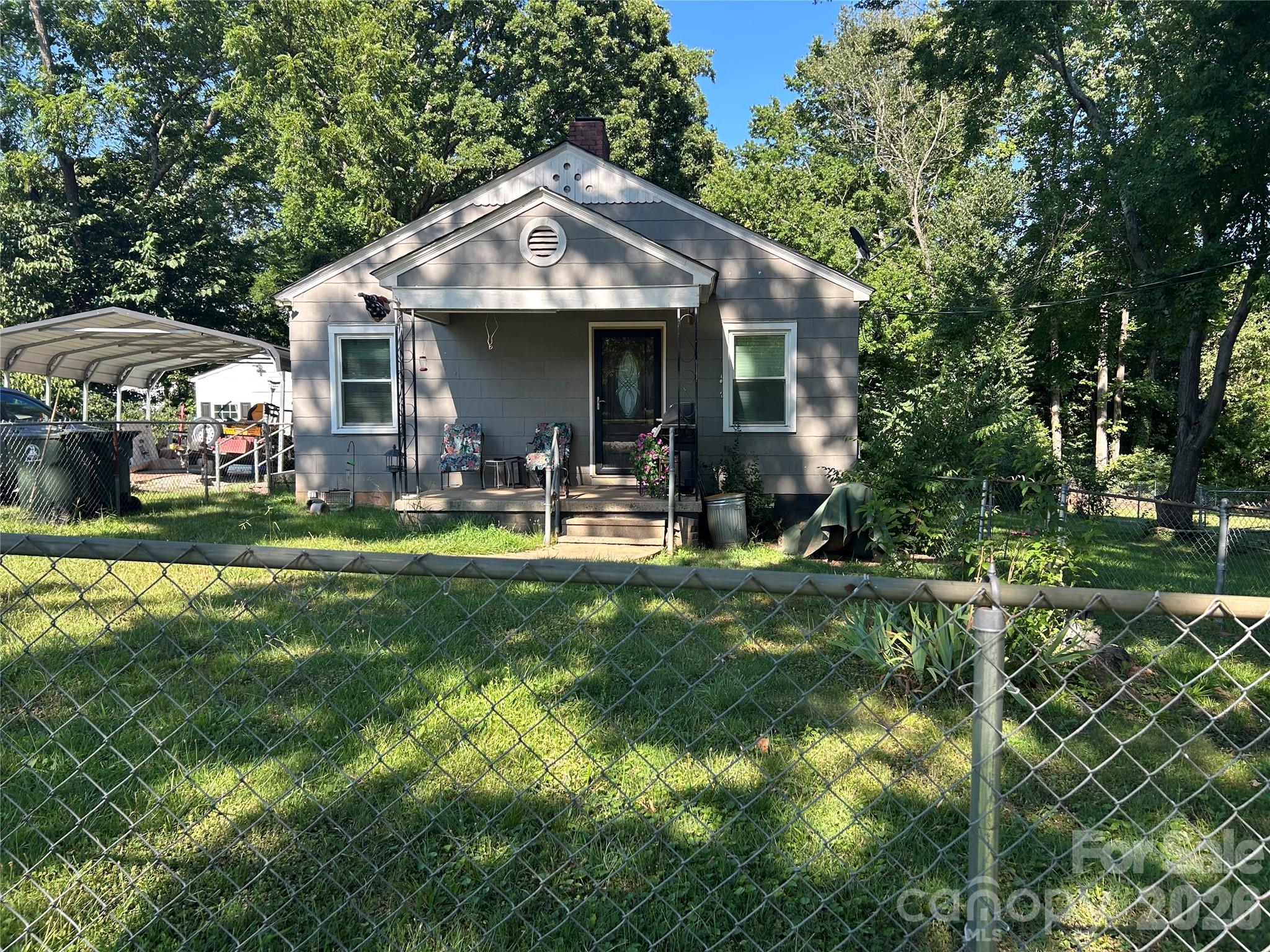 Welcome to this charming 3-bedroom, 1-bath home nestled in the heart of Gastonia. Offering the perfect blend of comfort and convenience, this inviting home features an easy-flowing floor plan, a level yard, city water and sewer, and a detached garage with plenty of room for storage, hobbies, or a workshop. Fresh updates with a recently updated kitchen and new windows, updated wood door with beveled glass, hardwood floors in living room and new LVP in kitchen. Enjoy the ease of in-town living while being just minutes from historic downtown McAdenville, where you’ll find locally owned shops, restaurants, and year-round festivals. Whether you’re a first-time homebuyer, looking to downsize, or searching for a smart investment opportunity, this property offers exceptional value in one of North Carolina’s most sought-after small towns. Relax on the front porch, enjoy the spacious yard and appreciate the convenience of nearby parks, schools, and everyday amenities. With its desirable location, manageable size, and welcoming character, this home is ready for its next chapter. Come experience the charm and lifestyle that make Lowell such a special place to call home!