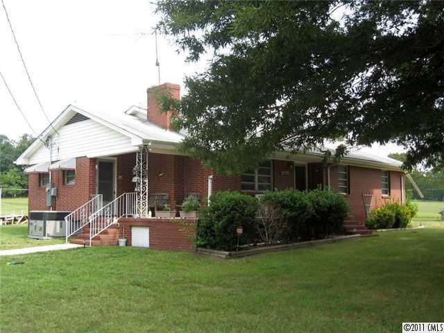 Beautiful 21.5 acres would make lovely home sites, with ponds.  Brick home is rented , has 4 stall shed, single garage/ and carport, Little brown building belongs to renter and will be removed. Owner will consider selling house and less land