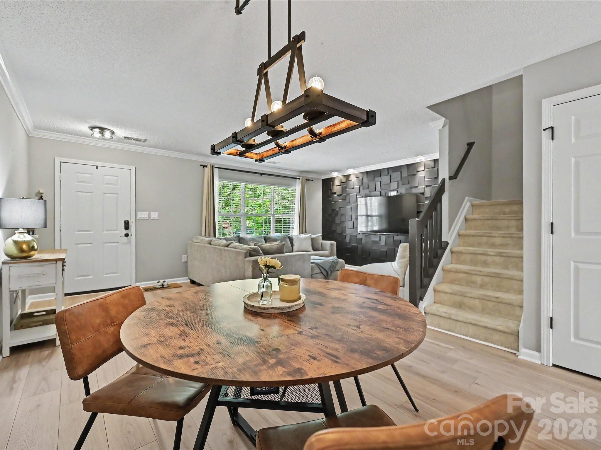 Beautifully renovated townhouse in the heart of desirable Ballantyne! This move-in ready 2-bedroom, 2.5-bath home offers the perfect blend of style, comfort, and convenience, all just minutes from The Bowl at Ballantyne and Target at Stone Crest. The updated kitchen features stunning white quartz countertops, a sleek tile backsplash, and modern finishes that make both cooking and entertaining a delight. The main level has been upgraded with durable new LVP flooring throughout, creating a fresh and inviting feel from the moment you walk in. Make sure you check out the stylish accent wall in the living room and the hidden media storage!

The fenced yard with a back patio provides privacy for a relaxing place to start your day or unwind in the evenings. Out front two parking spaces are assigned right outside your door.

Upstairs, you’ll find two spacious bedrooms, each with access to their own full bath and designated walk in closets. The  convenient half bath downstairs is perfect for guests. Additional updates include a new hot water heater for added peace of mind. Even better the refrigerator, washer, and dryer all convey with the home, and the seller is including a 12-month home warranty, making this an incredible opportunity for buyers seeking low-maintenance living in a prime location.

Schedule your showing today!